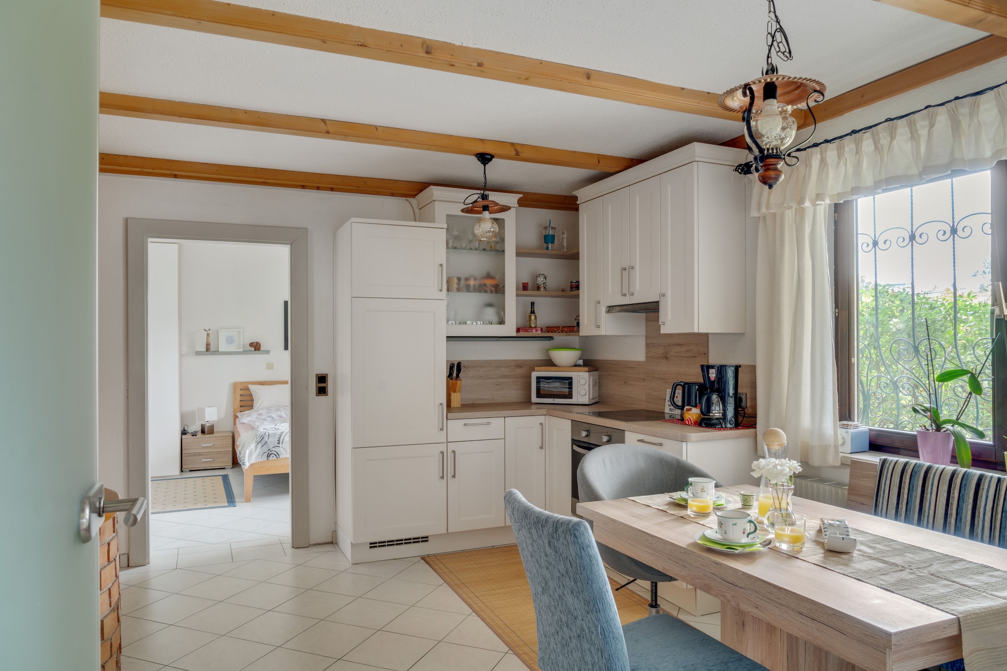 On the 1st floor: (Entrance, Living room(TV, dining table), Kitchen(electric kettle, coffee machine, oven, microwave, fridge-freezer), bedroom(double bed or 2 single beds), bathroom(shower, hairdryer), toilet)\n\ndishwasher, terrace, bicycle storage, garden furniture, parking