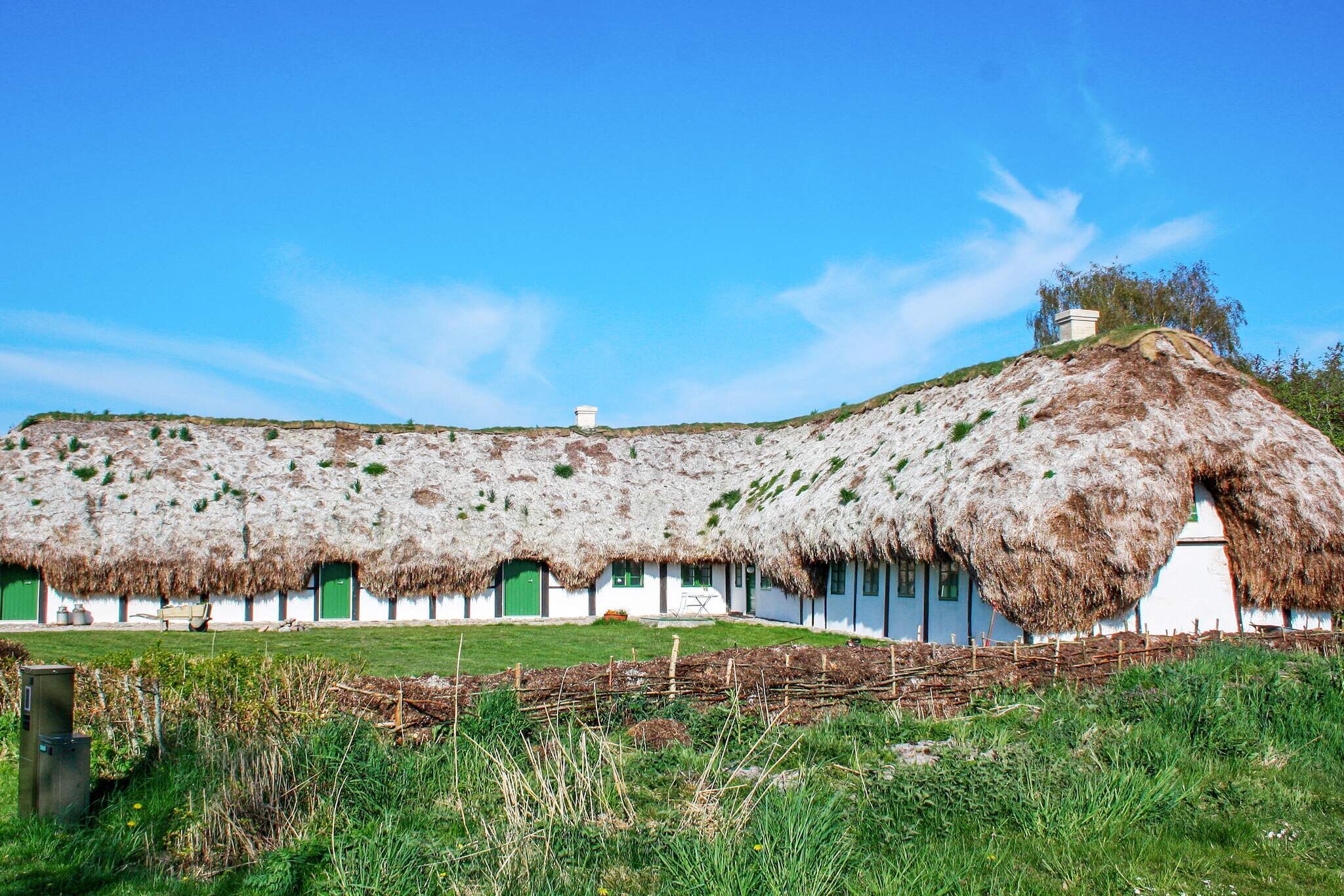In the middle of Læsø's unique nature and close to Østerby is this completely unique and idyllic holiday home with plenty of space for family, friends / employees or courses / meetings. For the 2021 season, a sun terrace with a wilderness bath for 8-10 people has been laid out. The beautiful hall in the old barn adjacent to the main house is very special with the interior visible seaweed roof. In this hall there can be up to 30 people and with the associated facilities such as big screen and kitchen, this means that in connection with the stay, you can invite to events such as day meetings, courses and the like. In the hall there is AV equipment, 75 & # 8221; big screen, whiteboard, printer and wifi + fiber network. The house is from 1740 and completely renovated in 2019, but has preserved the soul of the house. It is one of the few seaweed farms on the island and allows for an unforgettable and unique experience The cottage has six bedrooms, each with their unique decor, lights and colors. The rooms are furnished with two single beds that can be pushed together as double beds. Two delicious bathrooms, which have a good light, underfloor heating and large shower. Utility room with washer and dryer. There is an extremely well-equipped kitchen with separate dining room and cozy living room with TV, fiber network and Chromecast for those cozy evenings. The house is heated all year round and the only consumption you pay is for water. There is underfloor heating throughout the house. The outdoor areas are absolutely ideal for play for children and other childish souls and here are equipment for various activities, garden furniture for sunbathing and barbecue evenings in the fantastic nature as well as a wonderful campfire site. There are lots of activities at the house, among others. swimming pool, activity box with play and outdoor games, sandbox and fishing rods. In addition, there is an orchard where you can pick apples, berries, etc. There is also a cozy campfire for 12 people and ball field for football / round ball for internal competitions. Approx. 400 meters to water area perfect for water sports, SUP, sea kayaking and surfing in calm water. THE HALL and associated kitchen may be used by the 12 guests who can b

A refundable deposit might be charged closer to your check-in date. This deposit covers utilities consumed during your stay and any additional services that may be taken. The final amount will be adjusted based on actual meter readings, actual usage of extra services, and any remaining balance will be refunded within 21 days after checkout.