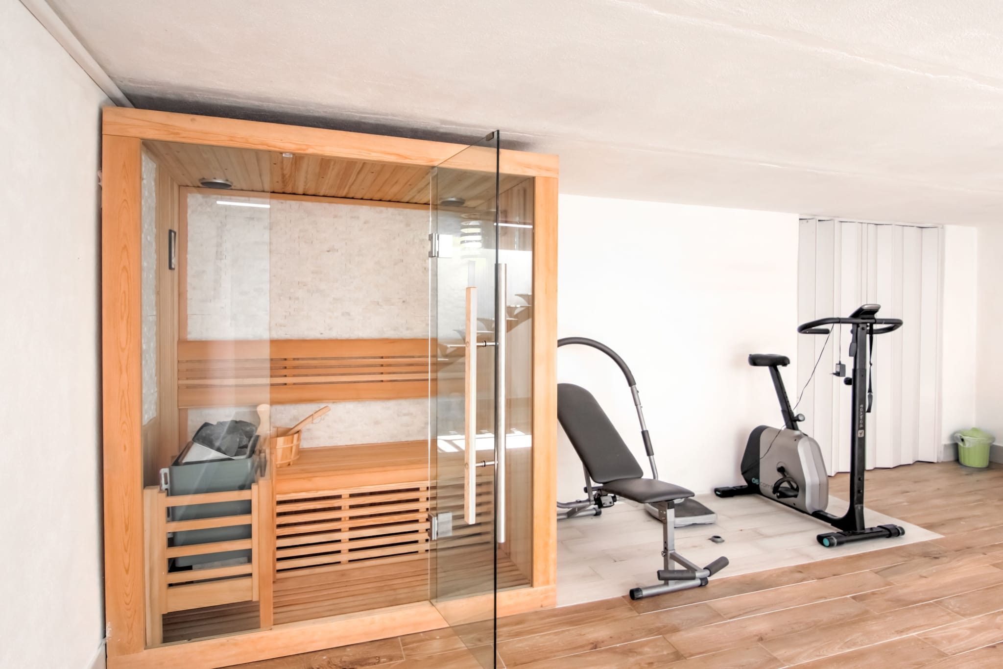 Ground floor: (Living room(fireplace, seating area), dining room(dining table), Large kitchen(hob, oven, dishwasher, fridge-freezer, washbasin), bedroom(single bed, single bed, single bed), bedroom(single bed, single bed, single bed), bedroom(single sofa bed, double bed), bathroom(shower, washbasin, toilet, bidet), bathroom(shower, washbasin, toilet, bidet), bathroom(shower, washbasin, toilet, bidet))\n\nhot tub, sauna, washing machine, terrace, garden furniture, BBQ, parking, swimming pool(private, opened from May upto and including Sep), table tennis table, football goal, fitness equipment, plancha grill