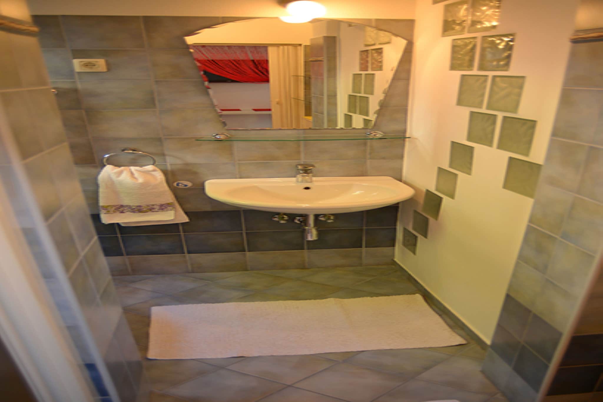 On the 1st floor: (Kitchen(stove, electric kettle, coffee machine), open kitchen(shared with other guests, acces via outside stairway, 24 m2)(seating area, grill), Living/bed room(double sofa bed), Living/diningroom(TV(flatscreen, satellite), dining table, seating area), bathroom(shower, toilet), balcony, air conditioning)