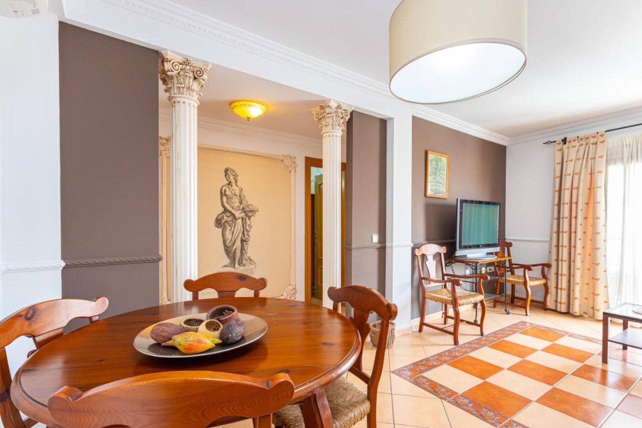 Ground floor: (Large kitchen(toaster, hood, coffee machine, microwave, fridge-freezer), Living/bed room(single sofa bed, double sofa bed, TV, dining table), bedroom(small double bed, TV), bedroom(single loft bed), bedroom(single loft bed), bathroom(bathtub or shower, toilet, washing machine), balcony, air conditioning)\n\nparking