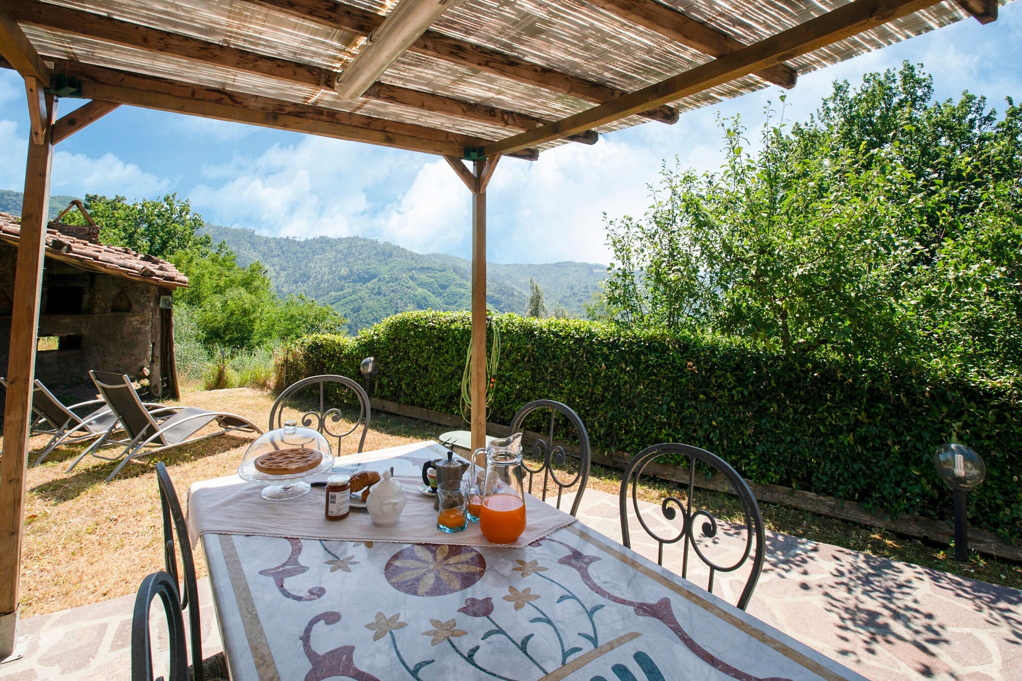 Delightful stone holiday home of the eighteenth century, 12 km away from Lucca. Ideal for spending relaxing holidays with family, 10 people in 5 rooms can be comfortably accommodated here, amidst nature while you enjoy an enchanting panorama view of olive trees, vineyards and woods.
Due to its strategic position, the Casa di Laino represents an ideal base to visit places of historical and artistic interest such as Florence (90km), Siena (155 km), Pisa (30km), the Marble Quarries of Carrara lies an hour’s drive away. Beach can be accessed easily after a drive, where you will have the pleasure of reaching Versilia where you will spend some pleasant time between sunbathing and Haute Couture shops.
The renovation has kept intact the charm of an ancient structure with the classic rafters and terracotta floors, combining modern comfort to make your stay pleasant and pleasant. The equipment of an outdoor courtyard and a garden offers the possibility of relaxation for those who do not want to give up a good book or sunbathing under the Tuscan sun.
Pisa - Galileo Galilei Airport lies 36 km away.