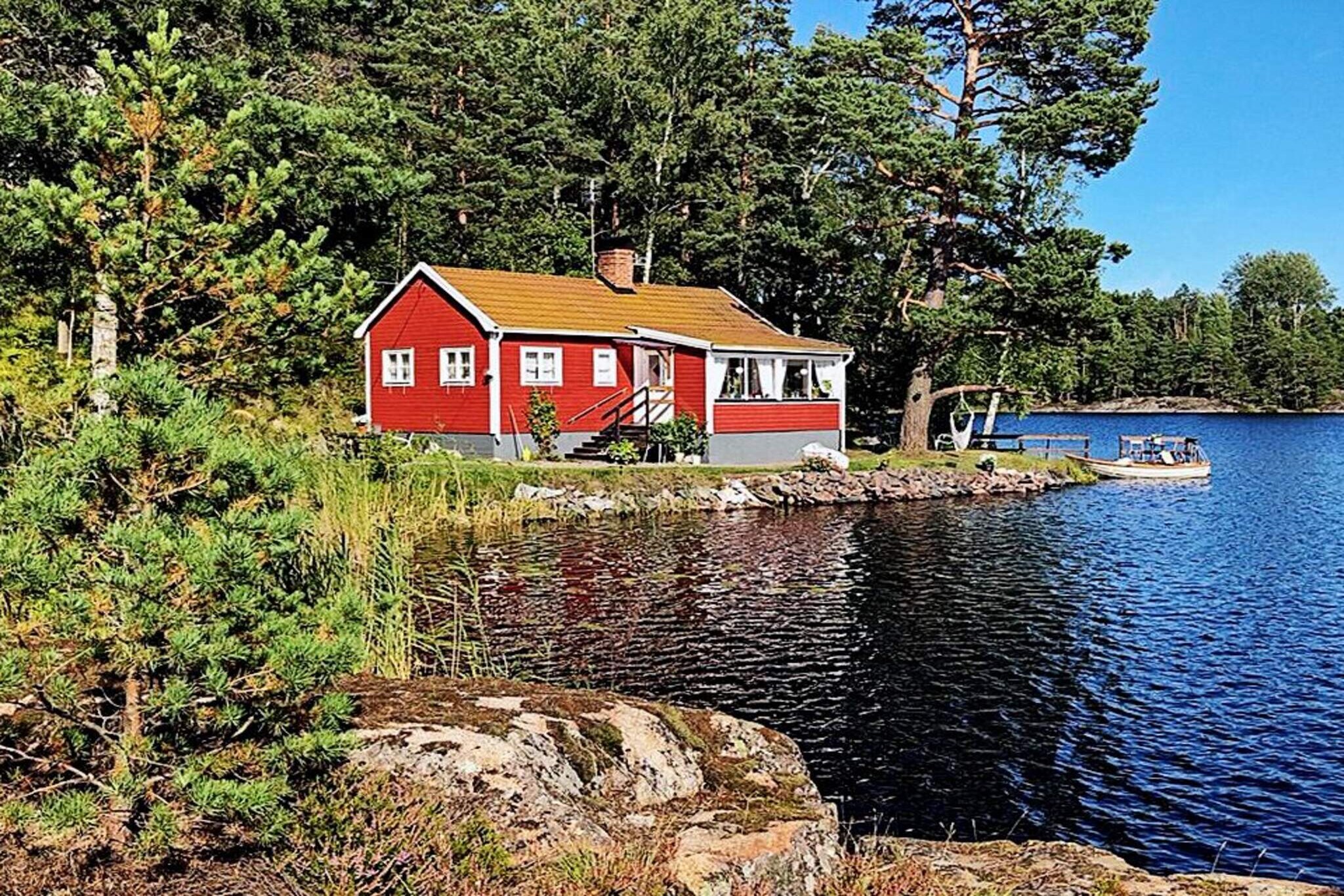 This lovely cottage is located right at the water's edge to its own lake, you can not get closer to the water! A nice cottage with a cozy living room with fireplace, sofa bed and day bed, so there is plenty of seating. Outside the living room there is a really large glazed porch with a large table and a breathtaking view of water and forest, here you eat your meals accompanied by a glorious view, in the evening you have the sunset to enjoy. You can take a bath in the wood-fired tub or in the lake right next to the house. Unfortunately, the cabin does not have a shower. Two bedrooms, one with a double bed and one with single beds. Toilet is in the cottage and outside you have an wood-fired bath, or why not jump off the bridge and take a dip? A rowing boat is included in the cottage rent, paddle out and throw in a float, maybe you get a fish for the grill in the evening. If you have pre-ordered cleaning or bed linen, this must be paid on site at the beginning of the week. You will find more information in the house. See the guest folder. In the surroundings there is a lot to experience and discover. For example you can take an archipelago boat further out in the archipelago, discover the summer town of NorrtÃ¤lje or other gems. Welcome to a wonderful holiday stay with sun, swimming and nature!