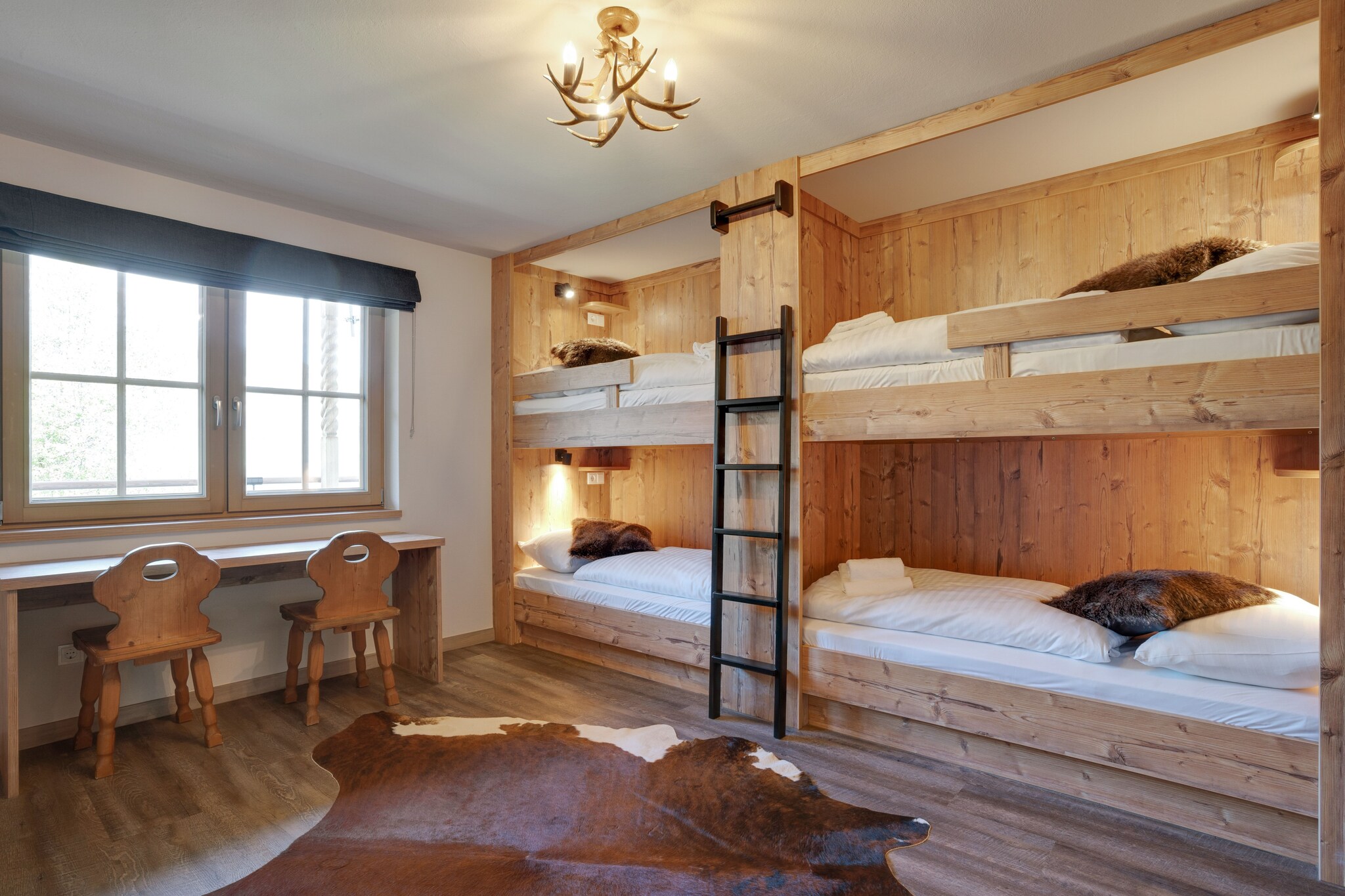 Ground floor: (Living room(TV, decorative fireplace, seating area, seating area, seating area), dining room(dining table(18 persons)), open kitchen(electric kettle, toaster, cooker, coffee machine, oven, oven, microwave, dishwasher, fridge, fridge-freezer), toilet(washbasin, toilet), washing room(tumble dryer, washing machine, ironing board, iron), ski storage(ski boot heaters))\n\nOn the 1st floor: (Bedroom with bathroom(double bed, shower, washbasin, toilet, balcony), Bedroom with bathroom(double bed, shower, washbasin, toilet, balcony), Bedroom with bathroom(double bed, shower, washbasin, toilet, balcony), Bedroom with bathroom(bunk bed, bunk bed, bunk bed, bunk bed, shower, washbasin, toilet, balcony))\n\nOn the 2nd floor: (bedroom(double bed, balcony), bedroom(double bed, balcony), Bedroom with bathroom(double bed, shower, washbasin, toilet, balcony), Bedroom with bathroom(double bed, shower, washbasin, toilet, balcony), bathroom(shower, washbasin, washbasin, toilet))\n\nterrace, garden