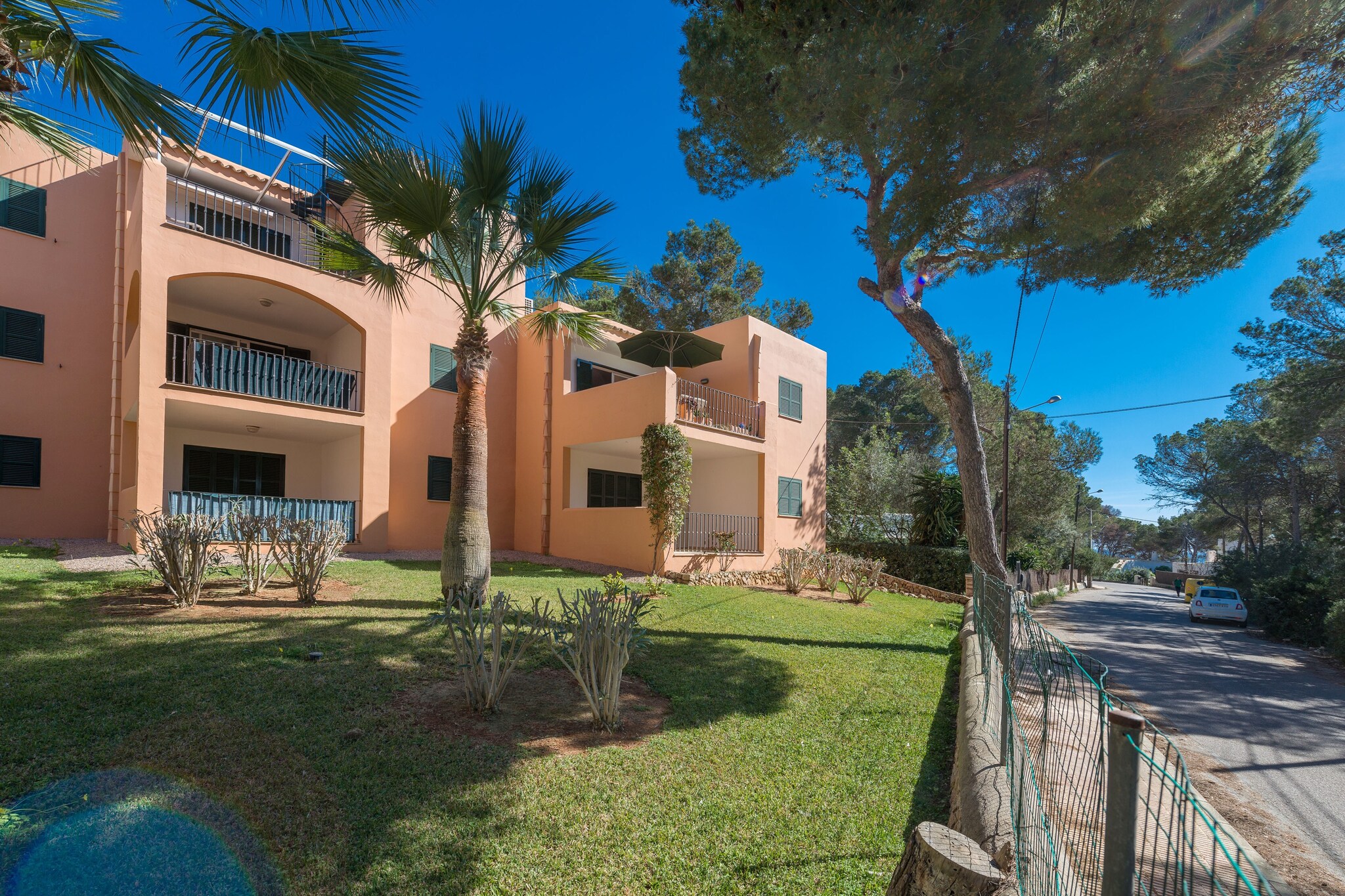 This fantastic first floor apartment (no lift available) is located within a family apartment complex. The private terrace is the perfect place for your breakfast, accompanied by the beautiful to the pine grove in front, or to have lunch or dinner alfresco after spending a great day amidst crystal-clear waters. You will see the see once you go outside to the streets and reach the sand in juts 80 metres!

Inside the apartment, you'll find a spacious, modern, and beautiful area with air conditioning that combines the kitchen, dining room, and living room. Here, you can cook delicious meals on the ceramic hob, dine together, and relax on the sofa while watching SAT-TV. There are two bedrooms with wardrobes: one with two single beds and the other with a double bed. Only the double bedroom has air conditioning. A cot and high chair are available for a baby. The bathroom has a bathtub. There is also a washing machine, iron, and ironing board.

The accommodation is near the small fishing town of Porto Petro (Santanyí). Specifically, it's located in Barca Trencada, a privileged place for those in love with paradisaical beaches. In fact, you can reach 5 beautiful virgin beaches on foot, the first of them only 80 metres away, and the Natural park of Mondragó. The golf course of Cala d'Or is less than 9 km away.

Please, note that the lawn in the complex is not accessible. Consult the advertiser for possible charges. Pets are not allowed. The holding of events is forbidden. 
Distances
Beach: 0.083 km - Cala Barca Trencada
Airport: 56.9 km - Son Sant Joan
Golf course: 8.6 km - Cala d'Or
Town: 2.5 km - Porto Petro
Train station: 34.7 km - Manacor
Bus stop: 2.5 km - Porto Petro
Ferry: 64 km - Puerto de Palma
Hospital: 35.6 km - Hospital de Manacor
 Guests are kindly required to dispose of all rubbish and ensure the property is properly tidied before departure. Should this not be the case, a charge of €90 will be deducted from the security deposit. Tourist license: ETVPL/15205Single Rental Registry: ESFCTU00000700800105007200000000000000000ETVPL/152051There's a mandatory tourist tax in Balearic Islands, called Ecotasa. All guests, except people under 16 years, have to pay this tax. The amount varies between 0.55€/night and guest during the low season and 2.2€/night and guest during  the high season .The tax is reduced by half from the 9th day for your stay. Homerti - Central de Reservas CR/33
