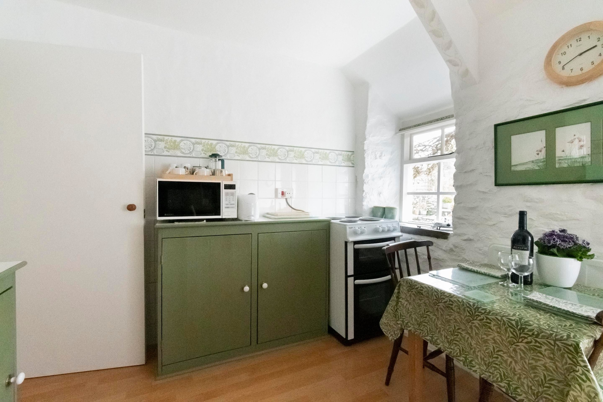 Ground floor: (Kitchen(dining table, electric kettle, toaster, cooker(4 ring stoves, electric), oven, microwave, fridge), Living/bed room(2x single bed, TV, seating area, DVD player, gas fireplace), bathroom(shower(unit), washbasin, toilet))\n\nheating(electric), garden, garden furniture, parking, pond