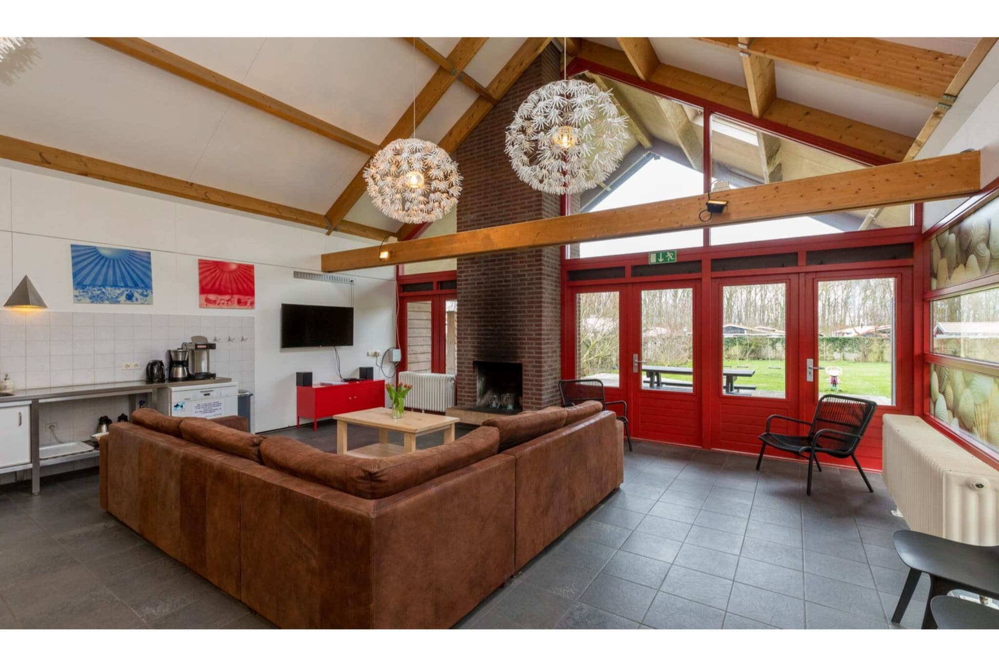 Ground floor: (Living room(TV(flatscreen), fireplace, seating area), open kitchen(dining table, electric kettle, coffee machine(filter), oven, microwave, dishwasher, fridge-freezer), bedroom(double bed), bathroom(shower, washbasin), bathroom(shower), storage(tumble dryer, washing machine), toilet(adapted for disabled), toilet)\n\nOn the 1st floor: (bedroom(single bed, single bed, single bed, single bed, single bed), bedroom(2x single bed), bedroom(single bed, single bed, single bed, single bed, single bed))\n\ngarden doors, garden, garden furniture, parking, play equipment