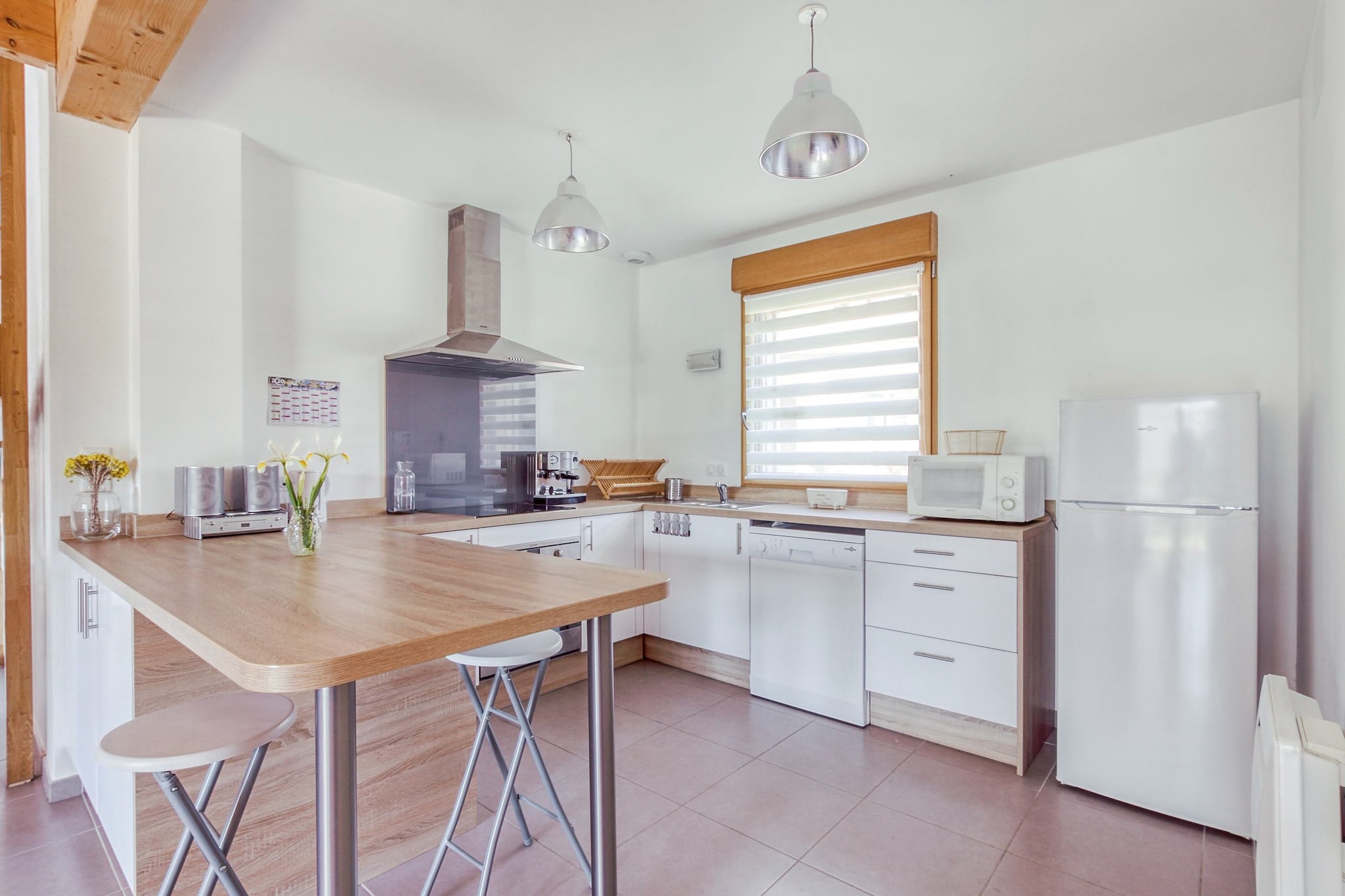 Ground floor: (Entrance, dining room(TV(satellite), dining table), open kitchen(radio, electric kettle, toaster, hood, espresso machine, oven, microwave, dishwasher, fridge-freezer), bedroom(double bed(140 x 190 cm), cot), bathroom(shower, washbasin), Study(single bed(120 x 190 cm)), toilet(toilet), washing room(washing machine))\n\nOn the 1st floor: (bedroom(double bed(140 x 190 cm)), bedroom(double bed(140 x 190 cm)), bathroom(shower, washbasin), toilet(toilet), mezzanine(play equipment))\n\ncarport, bathtub or shower, heating, terrace, BBQ, parking, bicycles available, children\'s bed