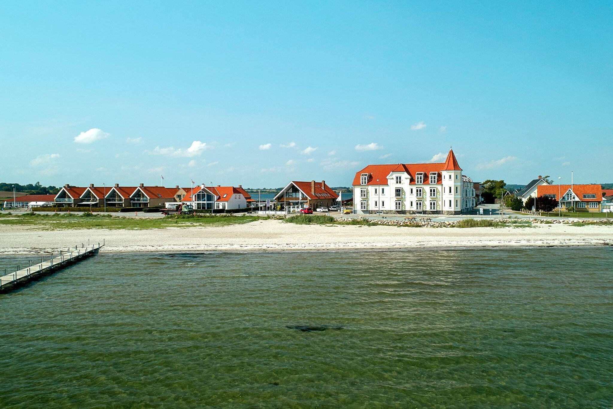 The holiday atmosphere quickly sets in when the bright and atmospheric surroundings welcome you to this charming seaside hotel from 1912. Right outside the door you can jump in the Little Belt from the bathing jetty. Watch movies on YouTube. About Hejlsminde Badehotel Already when you arrive at Hejlsminde Badehotel, you sense the very special atmosphere that makes you feel at home. It does not take long before you can feel the holiday atmosphere subside in the beautiful surroundings. Hejlsminde Badehotel has 24, individually decorated, apartments - all with sea views. The hotel was built in 1912, but has been lovingly renovated several times. The location is unique. In the middle of nature right next to the Little Belt and Hejlsminde Fjord. It is possible to swim or fish from the hotel's own jetty, or you can just enjoy the fresh air and the beautiful views during a stroll. The South Funen Archipelago beckons on the horizon, because it is part of the formidable view from Hejlsminde Badehotel.
A refundable deposit might be charged closer to your check-in date. This deposit covers utilities consumed during your stay and any additional services that may be taken. The final amount will be adjusted based on actual meter readings, actual usage of extra services, and any remaining balance will be refunded within 21 days after checkout.
