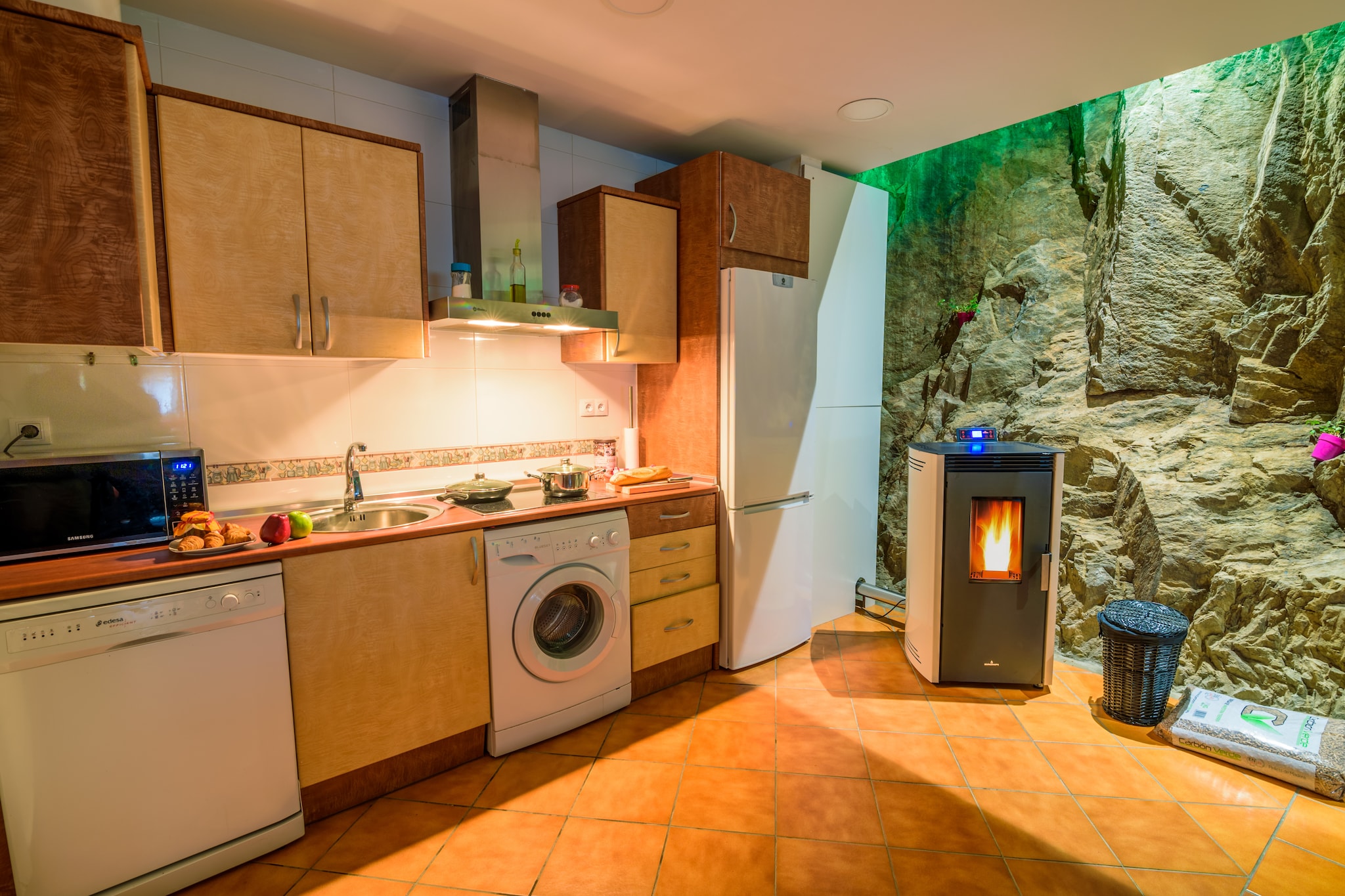 Tranquil Rural Escape
This recently built apartment embraces the traditional architecture of the region, blending stone and wood for a warm, inviting atmosphere. Step onto the shared terrace or garden to enjoy a cup of coffee, relax in the hammocks, or simply take in the serene surroundings. The Omaña river runs nearby, offering an idyllic setting for quiet mornings or sunset reflections. With a private barbecue area and garden furniture, you can enjoy meals outdoors in privacy while staying connected with nature.

Nature & Outdoor Activities
La Omañuela is surrounded by outdoor adventures for every season. Hike scenic trails, fish in the nearby river, or go mushroom picking in the surrounding woods. Winter months bring opportunities to ski at the Leitariegos resort, while other times of the year are perfect for observing native wildlife or exploring guided and self-guided routes through the Laciana and Babia regions. The property provides an ideal base for combining relaxation with exploration.

Local Charm & Dining
The small town exudes calm and authenticity, just 1.5 km from Pandorado and 5 km from Riello. Local eateries and markets allow you to sample traditional cuisine, while nearby lakes and rivers provide scenic spots for picnics. The towns of León and Oviedo are within driving distance for day trips, and the famous Cuevas de Valporquero caves are 35 km away. With parking available on site, exploring the region is easy and convenient. Pets are not allowed.