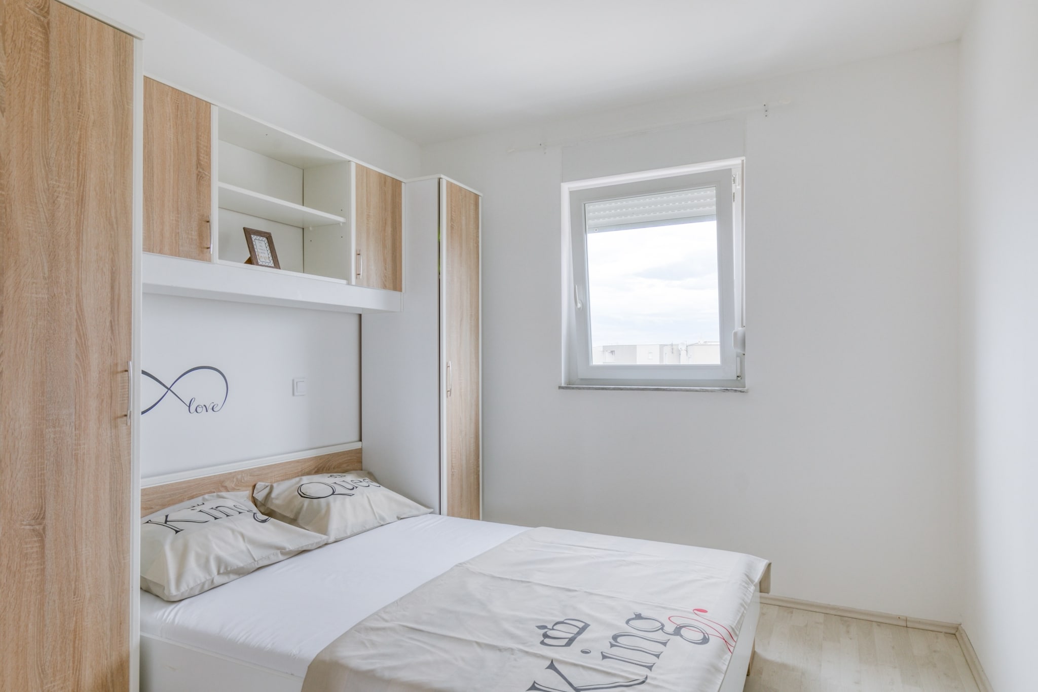 On the 2nd floor: (Kitchen(dining table, electric kettle, cooker, oven, fridge-freezer), Living/bed room(double sofa bed, TV(flatscreen, satellite), seating area), bedroom(double bed), bedroom(single bed, single bed), bathroom(shower, washbasin, toilet), terrace(private, fenced))\n\nbalcony, air conditioning, BBQ(shared with other guests), parking, ironing board, iron, hairdryer