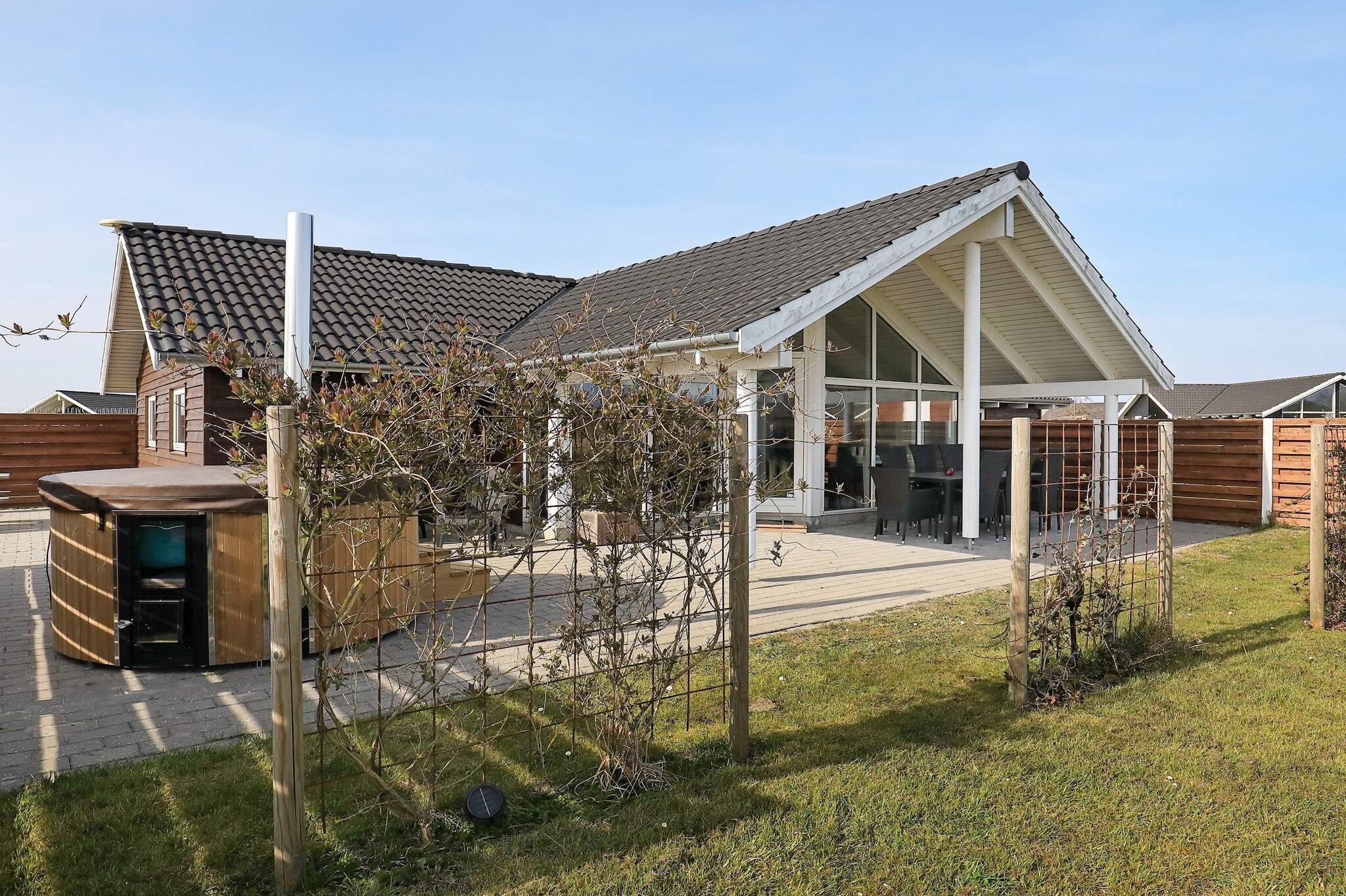 In Marielyst you will find this bright cottage with outdoor wilderness bath for 6-8 people on the large terrace, where you can enjoy yourself for many hours and sit and watch the stars in the evening. Bright, open kitchen with ceramic hobs, oven with grill, refrigerator with freezer, dishwasher, etc. The kitchen is open to the modern furnished living room. There are three bedrooms, all with double beds. In the large and cozy annex, which you have access to via the garage, there is a double bed and activity table with many different games, e.g. table tennis, billiards, table football and Nintendo Wii. Good large terrace with plenty of space to sunbathe and enjoy the barbecue. Not for rent to youth groups.

A refundable deposit might be charged closer to your check-in date. This deposit covers utilities consumed during your stay and any additional services that may be taken. The final amount will be adjusted based on actual meter readings, actual usage of extra services, and any remaining balance will be refunded within 21 days after checkout.