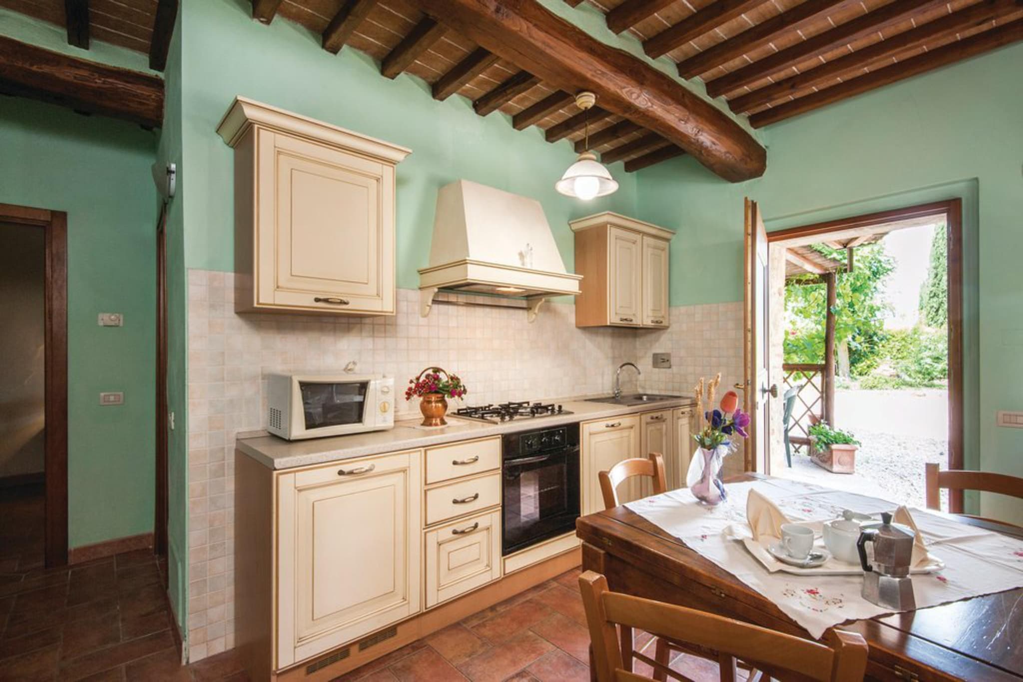 Ground floor: (open kitchen(hob(4 ring stoves, gas), boiling water tap, hood, coffee machine, oven, microwave, fridge), open kitchen(hob(4 ring stoves, gas), electric kettle, toaster, hood, coffee machine, oven, fridge), Living/diningroom(double sofa bed, TV(satellite), dining table), Living/diningroom(double sofa bed, TV(satellite), dining table), bedroom(double bed), bedroom(single bed, single bed), bedroom(double bed), bathroom(shower, washbasin, toilet, bidet), bathroom(shower, washbasin, toilet, bidet), heating(central, gas))\n\nOn the 1st floor: (open kitchen(hob(4 ring stoves, gas), boiling water tap, hood, coffee machine, oven, fridge), Living/diningroom(TV(satellite), dining table), bedroom(bunk bed), bathroom(shower, washbasin, toilet, bidet))\n\nwashing machine(shared with other guests), terrace(private), garden(shared with other guests, 3000 m2), garden furniture, BBQ(shared with other guests), parking, swimming pool(shared with other guests, 16 x  8 m., opened from May upto and including Sep)