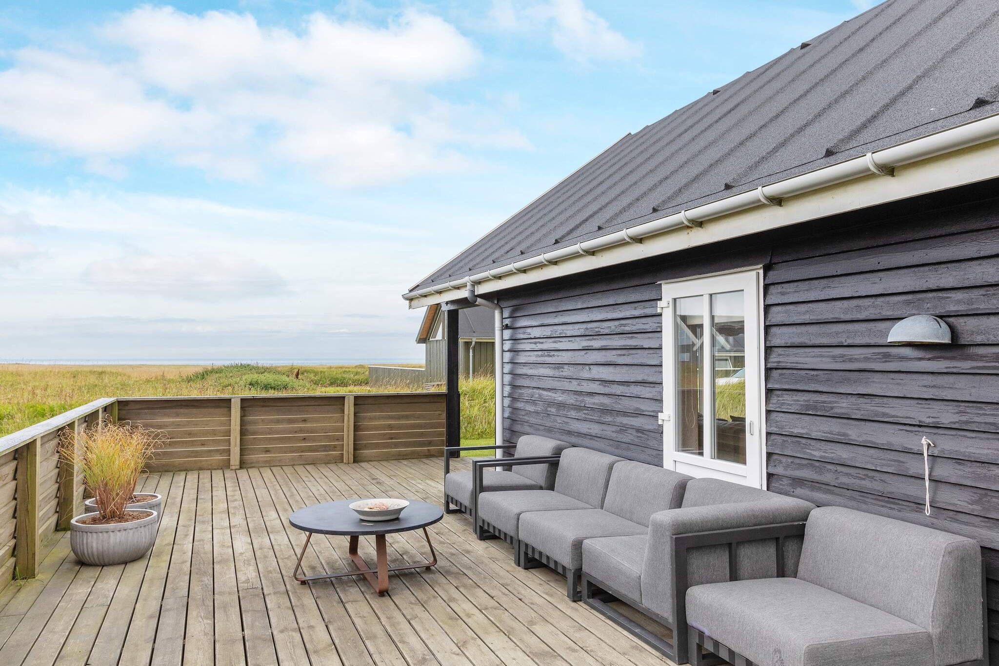 Internet Access DSL, open kitchen(cooker(electric), hood, coffee machine, microwave, dishwasher, fridge(+ freezer)), Living/bed room(TV(cable, german television channels, danish TV channels (DR1 and TV2)), DVD player, video, radio, CD player, stereo unit), bedroom(double bed), bedroom(double bed), bedroom(2x single bed), bathroom(floor heating)(bathtub or shower, washbasin, toilet, washing machine), heating(electric), terrace(roofed)