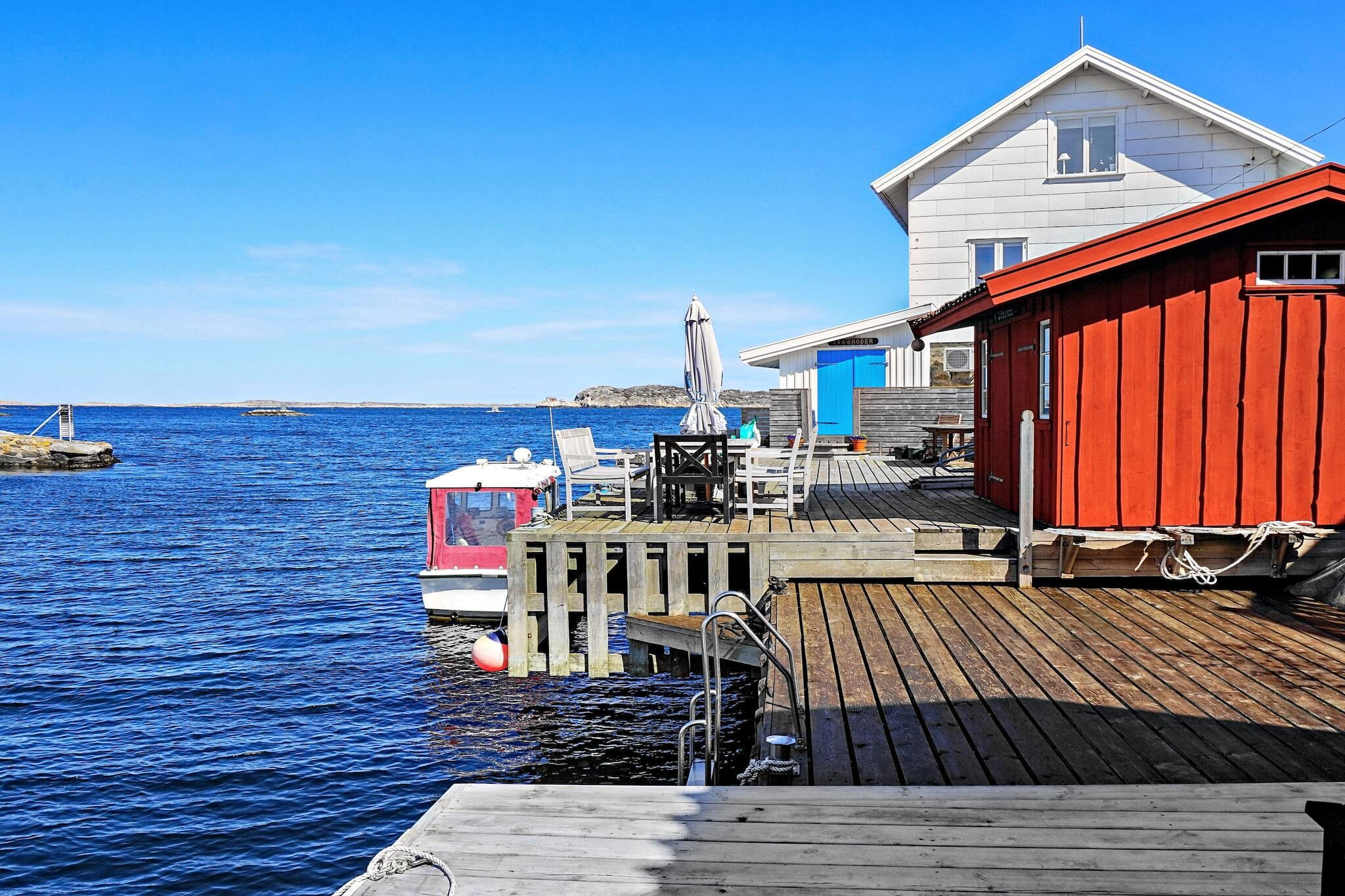 Wonderful f.d. fisherman's cottage from 1905, carefully renovated with fantastic location just a stone's throw from the sea on the genuine Gullholmen. Here you have a panoramic view from almost all the rooms of the house and can enjoy a wonderful holiday on one of the west coast's most beautiful islands. If this is not enough, you have two fantastic patios, one of which has its own jetty with bathing ladder! A perfect house for family or company who want to spend their holiday in the best location in a genuine BohuslÃ¤n environment. Feel free to start the day with a morning dip from your own jetty and then sit in the sun and just enjoy. Or serve breakfast and freshly brewed coffee in the kitchen or on the balcony - a better start to the day is hard to get! The cottage was partially renovated in 2015 when the entrance floor with kitchen, bedroom and bathroom was renovated. The kitchen is very tasteful and well equipped with a lovely dining area where you can really enjoy the magnificent views. Bright and nice bedroom with double bed 140 cm wide. Fully tiled and fresh bathroom that can be reached from both the bedroom and the hall. Upstairs there is an open living room with warming fireplace and carpet. The alcove has a double bed 140 cm wide. Here too you have a fantastic view. On the other side of the living room you have a TV corner with sofas, and a single bed in another alcove. Space also for extra bed, (folding with foam mattress) suitable for children. From the living room you have access to a small terrace with magical views, perfect for morning coffee. In the basement there is access to washing machine and dryer. The laundry room is shared with the owner who occasionally stays in a separate apartment in the basement. If you do not want to swim from your own jetty, there are several nice bathing places with rocks or sandy beach at a distance of about 200-400 m. Gullholmen is a unique island dating from the 13th century. Today, Gullholmen with a bridge connection to HÃ¤rmanÃ¶ is a vibrant community with about 120 year-round residents and many times more residents in the summer. Gullholmen has a fantastic environment in BohuslÃ¤n's outer archipelago with an active boating life, recreation in nature reserves, swimming, fishing with a unique settlement and environment. In addition to enjoying the island's atmosphere with small alleys and old beautiful fishing cottages, boathouses and piers, fantastic walks and wonderful bathing cliffs, there are also a number of attractions for those interested in culture, including Skepparhuset, Art Museum, Stenstugan and nature reserve on HÃ¤rmanÃ¶ with its heather moors, flowering meadows and moors. . There are many attractions and activities for the whole family; museums, boules court, soccer field, beautiful church to name a few. All services are available on the island; grocery store with a wide range, several restaurants, ice cream kiosk, cinema and library etc. If you want, you can rent a boat in the harbor for wonderful swimming or fishing trips or a lunch visit to Brygghuset in FiskebÃ¤ckskil, the possibilities are many! Gullholmen is a car-free island where you park at your own parking space in the ferry terminal in Tuvesvik on Orust. The ferry crossing takes only 5-10 minutes. The houseowner can pick the guests up at the ferry. Free WIFI via fiber. Welcome to a wonderful cottage with a unique location in BohuslÃ¤n's outer archipelago!