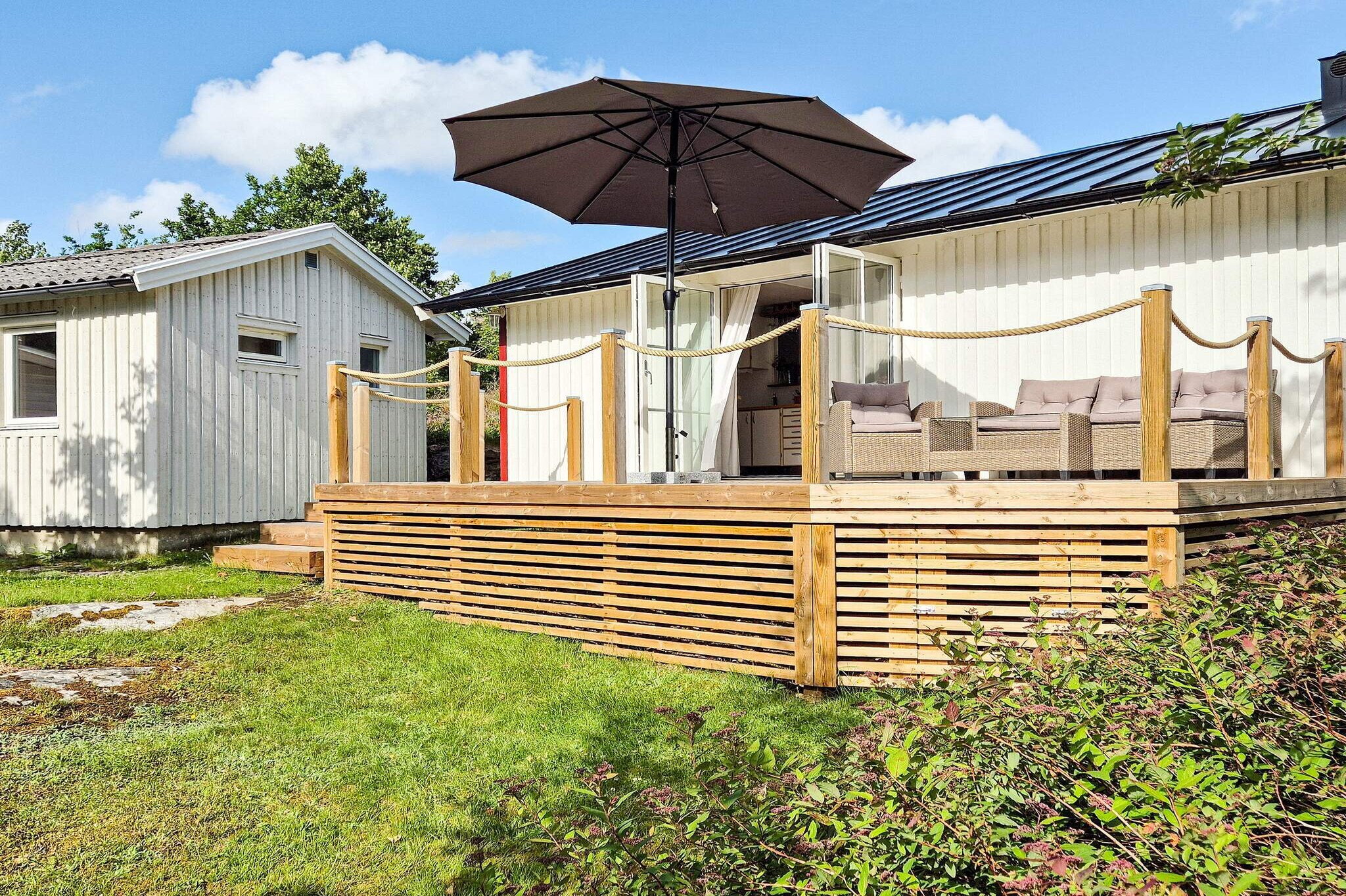 Annex: (single bed, double bed)\n\nopen kitchen(cooker(electric), hood, coffee machine, microwave, dishwasher, fridge(+ freezer), high chair), Living/bed room(TV, radio), bedroom(double bed), bedroom(2x bunk bed), bathroom(washbasin, shower, toilet, washing machine), heating(electric), parking