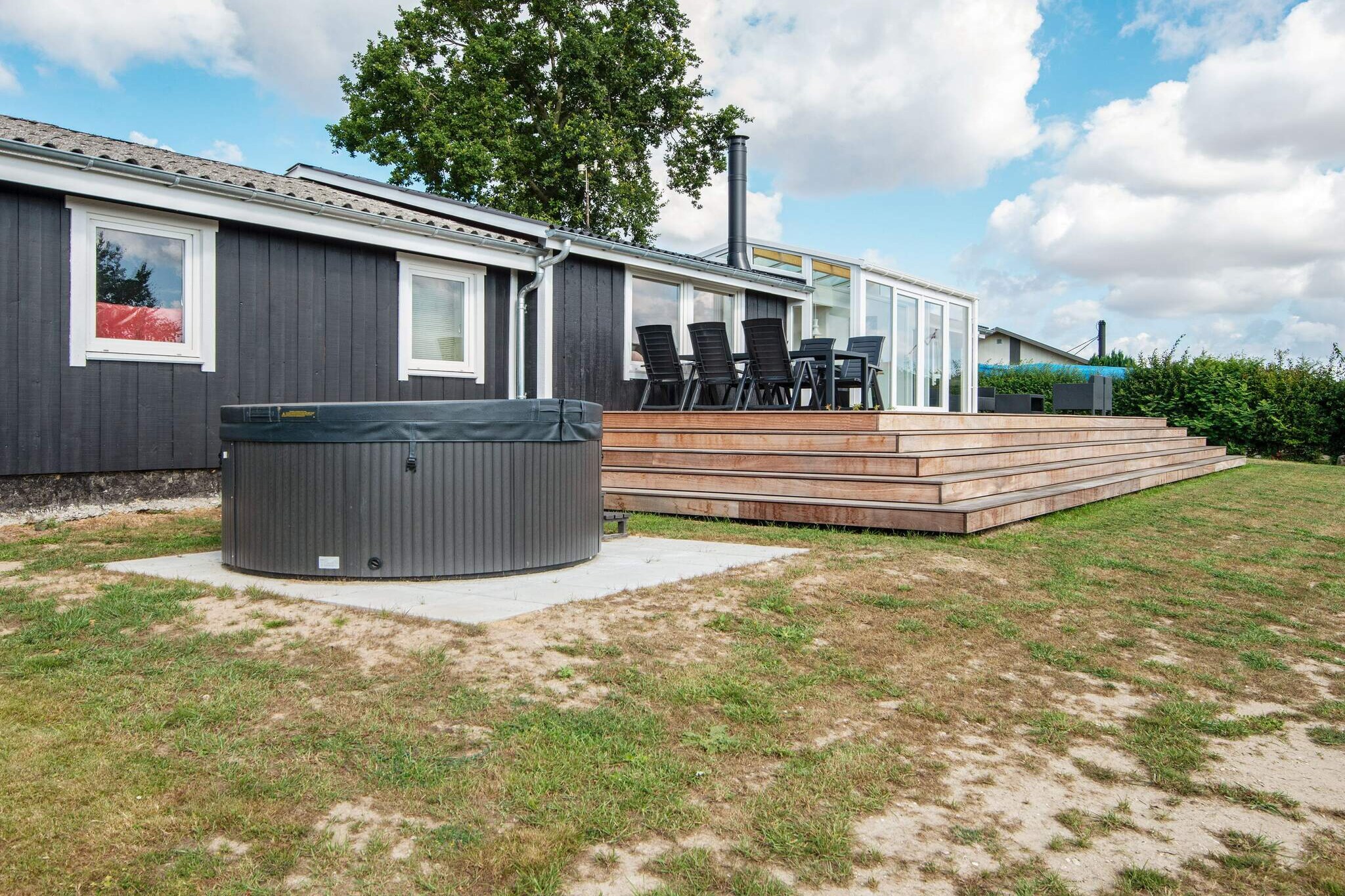 Kitchen(cooker(electric), hood, coffee machine, microwave, dishwasher, fridge-freezer), Living/bed room(TV(cable, german television channels, danish TV channels (DR1 and TV2)), radio, high chair), bedroom(double bed), bedroom(double bed), bedroom(double bed), bathroom(floor heating)(bathtub or shower, washbasin, toilet, washing machine), Bubble bath(outside), heating(electric), terrace, garden, BBQ, air to air heatpump
