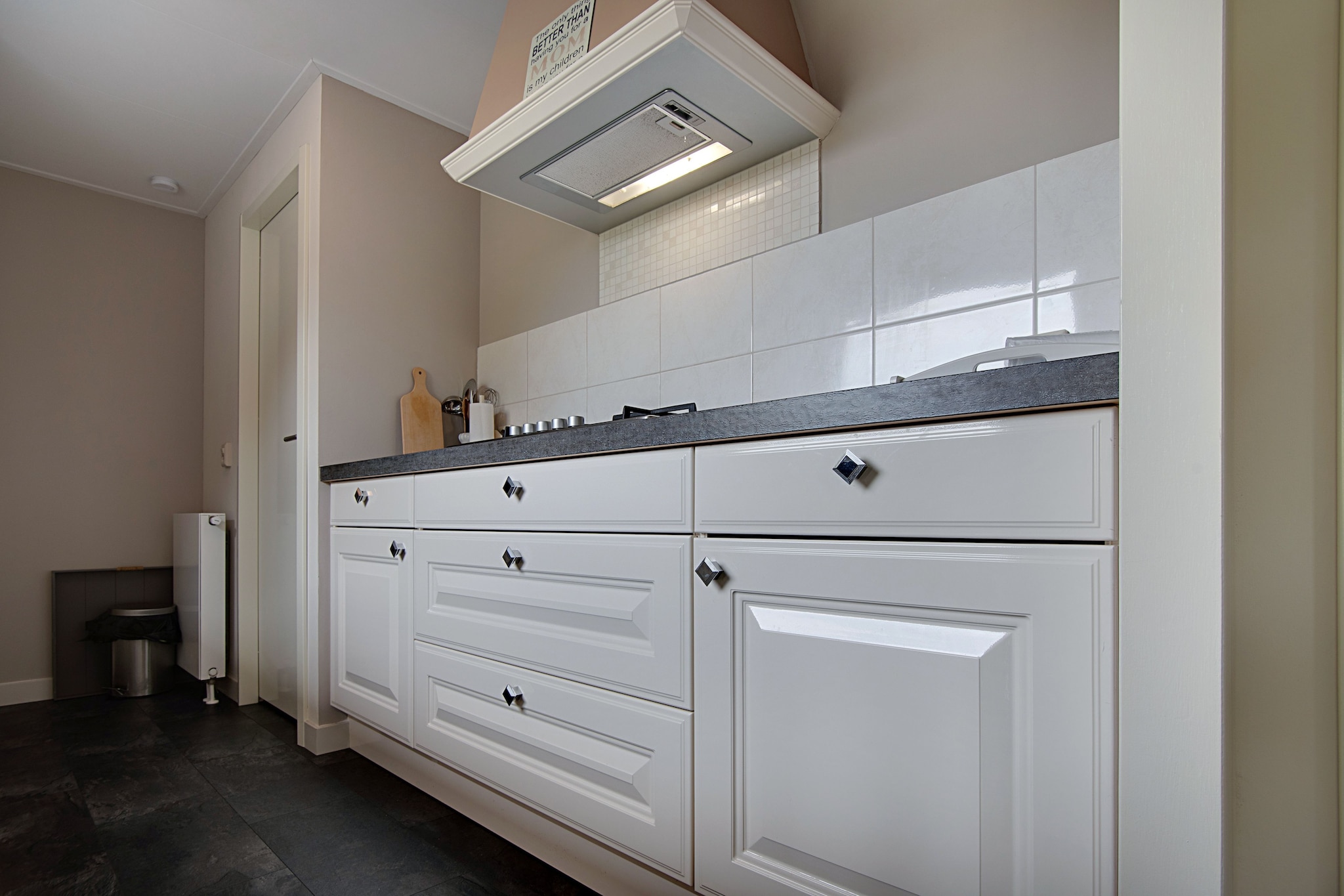 Ground floor: (Kitchen(hob(5 ring stoves, gas), electric kettle, hood, coffee machine(cups), combination microwave, dishwasher, fridge-freezer), Living/diningroom(TV(flatscreen, digital, dutch television channels, german television channels, international television channels), dining table, seating area), bedroom(single bed(duvet, boxspring, 90 x 200 cm), single bed(duvet, boxspring, 90 x 200 cm)), Bedroom with bathroom(double bed(boxspring, twin duvet, 180 x 200 cm), shower, washbasin, toilet), bathroom(shower, washbasin, toilet), storage)\n\ngarden doors, garden, bicycle storage, garden furniture, parking, lounge set, party games