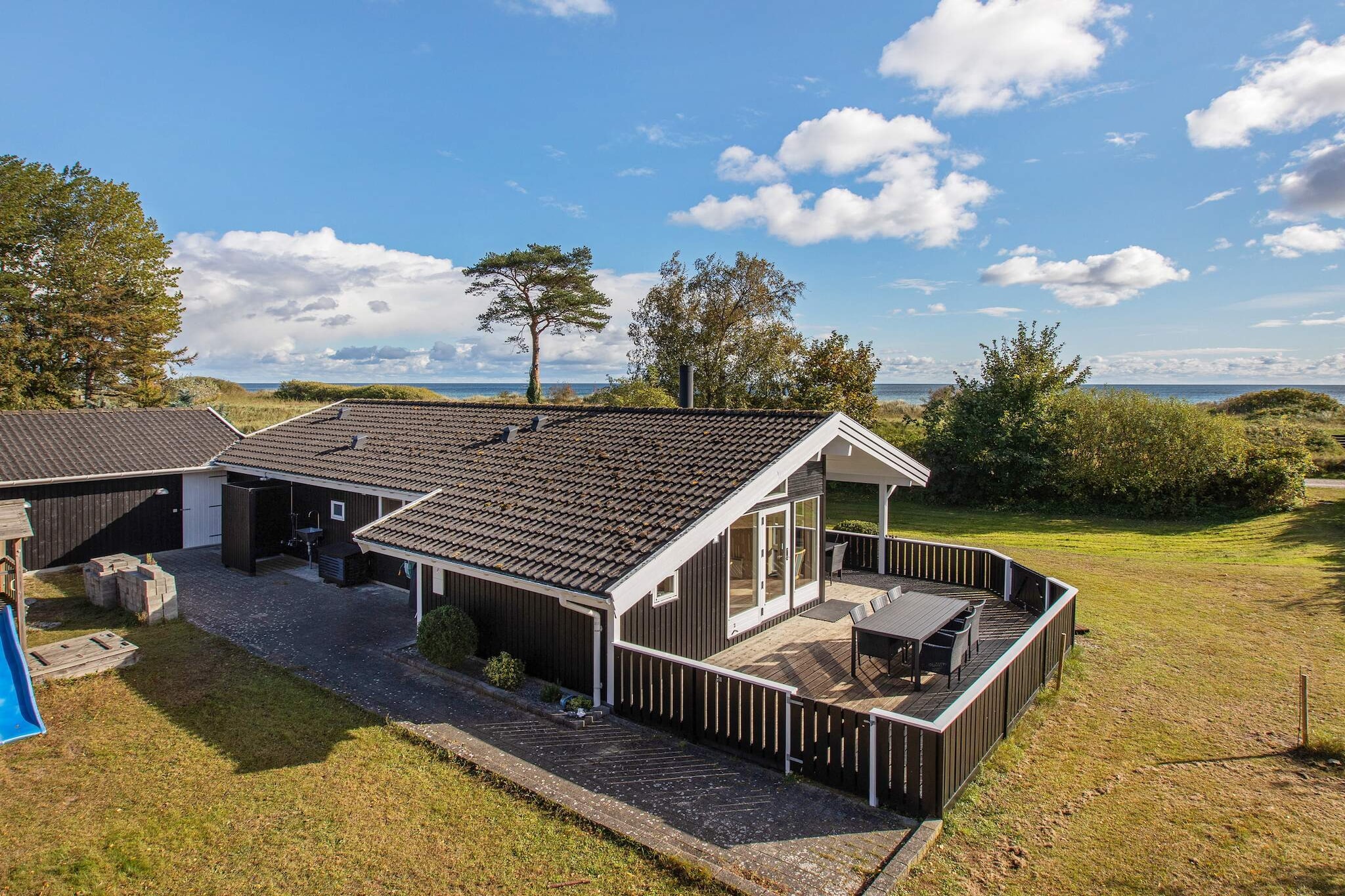 In the 1st row to the dike and approx. 100 meters to the beach in Marielyst is this cottage with whirlpool, sauna, wood stove and free wireless internet. There is an open kitchen with i.a. microwave and dishwasher, dining area and living room, from which there is access to large wooden terrace and garden. There are three good bedrooms divided into two rooms with double beds and a room with two single beds. Loft with 2 mattresses and an alcove. The bathroom has underfloor heating and newer shower. There is also a washer and dryer. For the little ones there is a cot, high chair, swing and sandpit. For the lovely evenings there is a barbecue. Not for rent to youth groups.

A refundable deposit might be charged closer to your check-in date. This deposit covers utilities consumed during your stay and any additional services that may be taken. The final amount will be adjusted based on actual meter readings, actual usage of extra services, and any remaining balance will be refunded within 21 days after checkout.