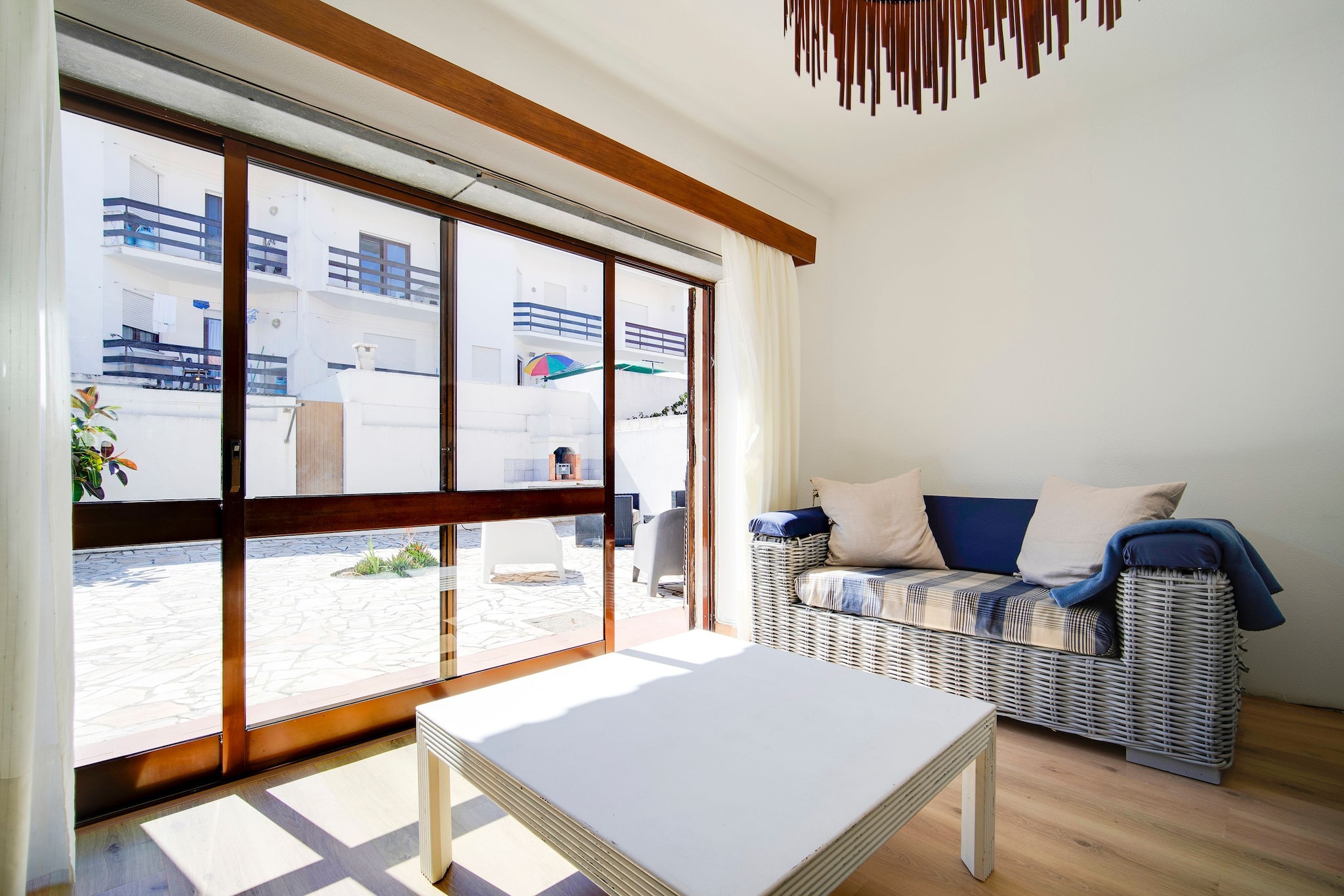 Ground floor: (Living room(TV, fireplace), dining room(seating area), Kitchen(oven, microwave, fridge-freezer), bathroom(washbasin, toilet), fireplace)\n\nOn the 1st floor: (bedroom(single bed, single bed), bedroom(single bed, single bed), bedroom(single bed, single bed), bedroom(single bed, single bed), bathroom(shower, toilet), bathroom(bathtub or shower, washbasin, toilet))\n\nterrace