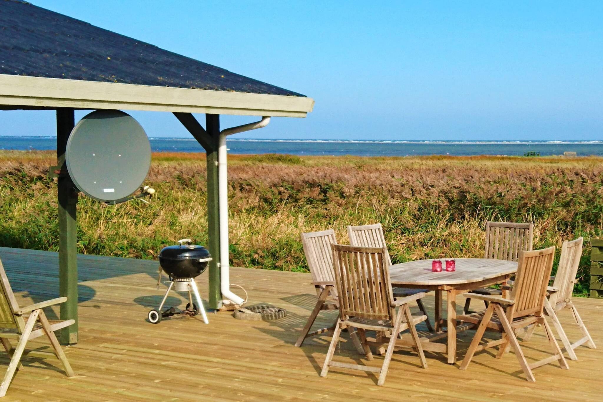 open kitchen(cooker(electric), hood, coffee machine, microwave, dishwasher, fridge), Living/bed room(TV(german television channels, danish TV channels (DR1 and TV2))), bedroom(double bed), bedroom(double bed), bedroom(2x single bed), bathroom(bathtub or shower, washbasin, toilet), heating(electric), terrace, terrace(roofed), BBQ, air to air heatpump