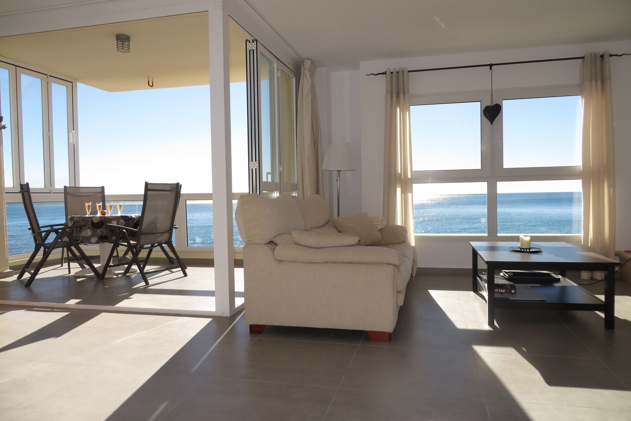 Ground floor: (Living room(TV(satellite, international television channels), seating area, Blu-ray player, stereo unit, heating, air conditioning), dining room(dining table(6 persons), heating, air conditioning), Kitchen(toaster, coffee machine, oven, microwave, dishwasher, fridge-freezer, washing machine), bedroom(double bed, heating, air conditioning), bedroom(double bed, heating, air conditioning), bedroom(2x single bed, heating, air conditioning), bathroom(bathtub or shower, toilet), bathroom(bathtub or shower, toilet))\n\nwashing machine, balcony, terrace(private), garden(shared with other guests), garden furniture, sun loungers, parking, swimming pool(shared with other guests)