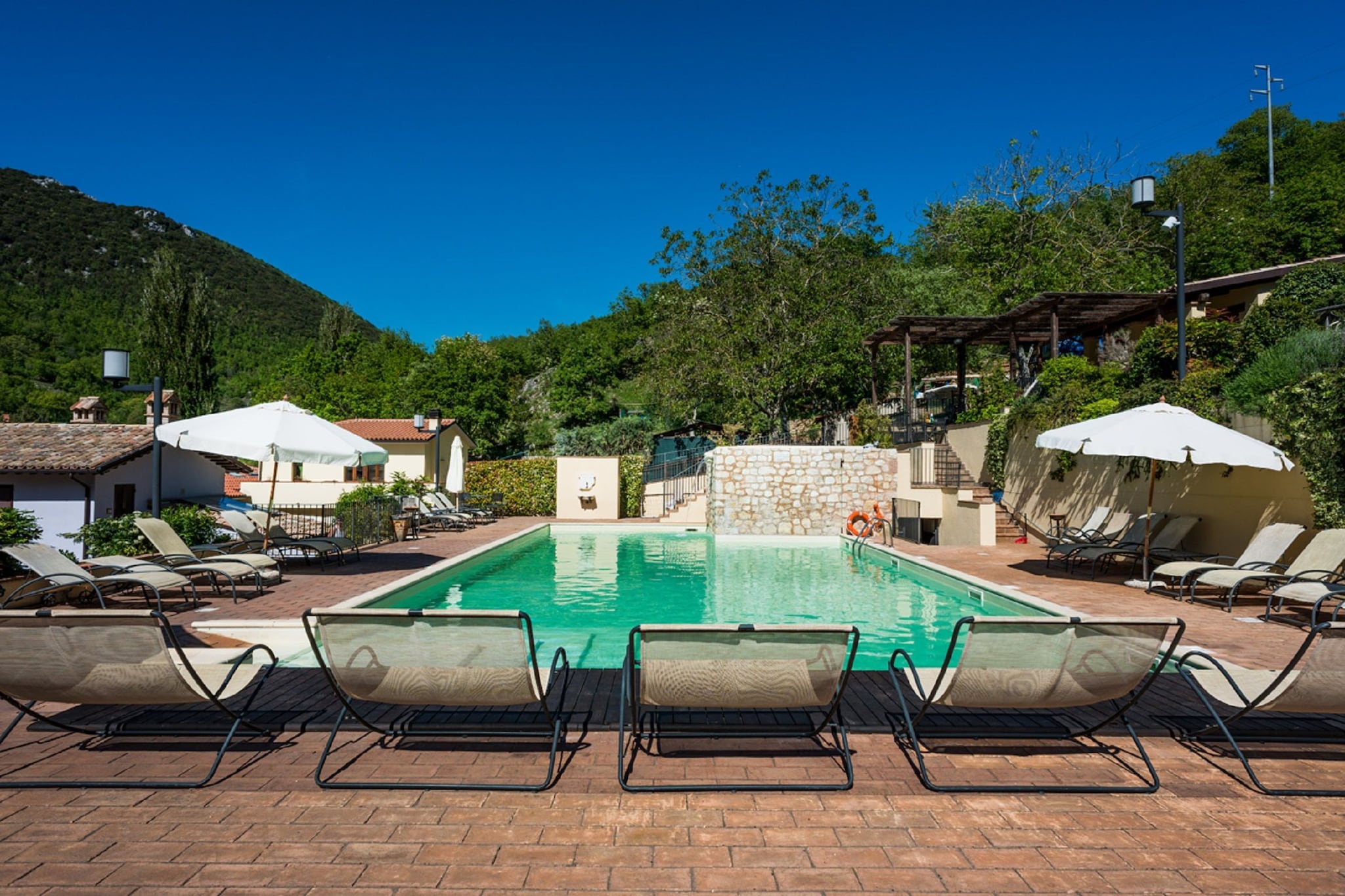 This apartment features modern furnishings and it is ideal for holidays with family or friends. Located in Foligno, Umbria, the property features an indoor and outdoor swimming pool.
The accommodation is located in a quiet area in Umbria, surrounded by beautiful greenery. With its fine location, it is very suitable for lovers of peace and nature. Supermarket and restaurants are a short distance from the apartment. Bicycles can be rented at the accommodation.
The apartment is elegantly furnished and equipped with all necessities. There is a living room, a well-equipped kitchen and a bathroom. Air conditioning provides cooling on hot summer days. Relax with a good book in the sun on the comfortable garden furniture or play a game of table tennis. For an extra charge, you can also use the sauna for ultimate relaxation.