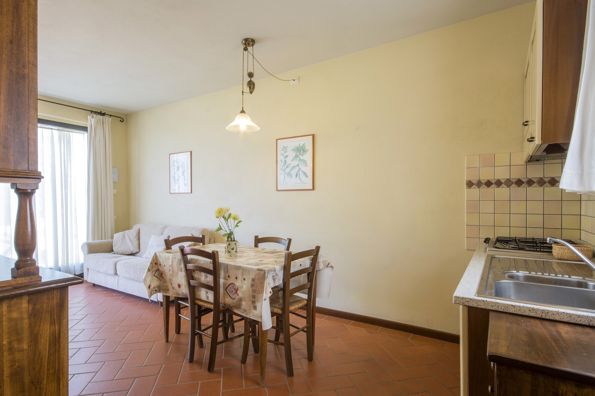 Ground floor: (open kitchen(hob, electric kettle, boiling water tap, hood, coffee machine, dishwasher, fridge), Living/diningroom(double sofa bed, TV(flatscreen, satellite), dining table(4 persons)), bedroom(double bed), bathroom(shower, washbasin, toilet, bidet))\n\nwashing room(washing machine(shared with other guests, paid)), terrace(private, 10 m2), garden(shared with other guests, fenced, illuminated, 10000 m2), garden furniture, sun loungers, BBQ(shared with other guests, charcoal), parking, parasol, swimming pool(shared with other guests, outside, fenced, 12 x  6 m., opened from May upto and including Sep), play equipment, table tennis table, insect screens, plancha grill
