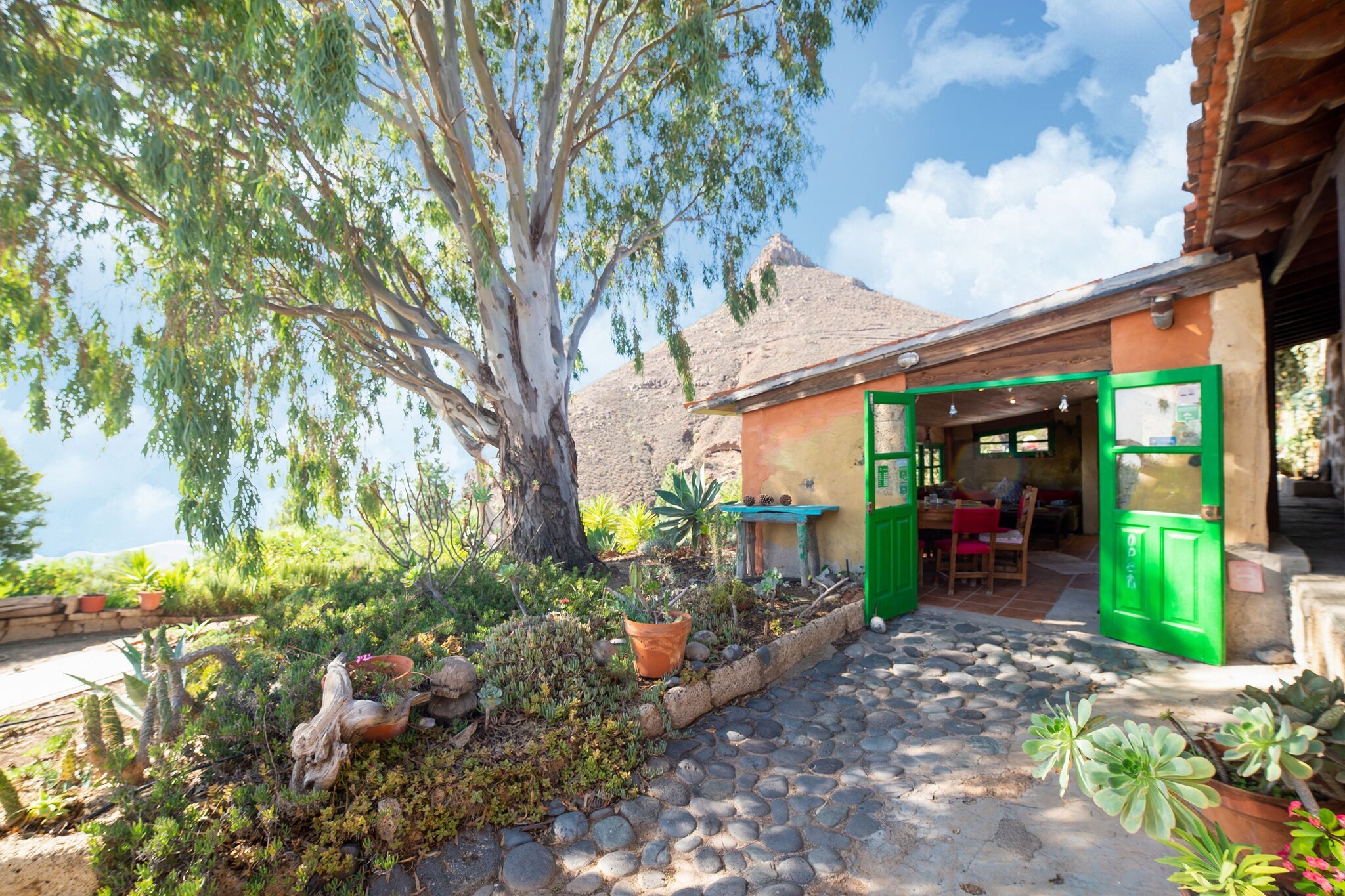 Ground floor: (Kitchen(dining table, coffee machine, espresso machine, microwave, dishwasher, fridge-freezer, washing machine), Bedroom with bathroom(double bed, bathtub or shower), Bedroom with bathroom(double bed or 2 single beds, bathtub or shower), Bedroom with bathroom(bunk bed, bathtub or shower), Bedroom with bathroom(double bed or 2 single beds, bathtub or shower), relaxation area(double sofa bed, TV, dining table, play equipment))\n\ngarden, solar energy