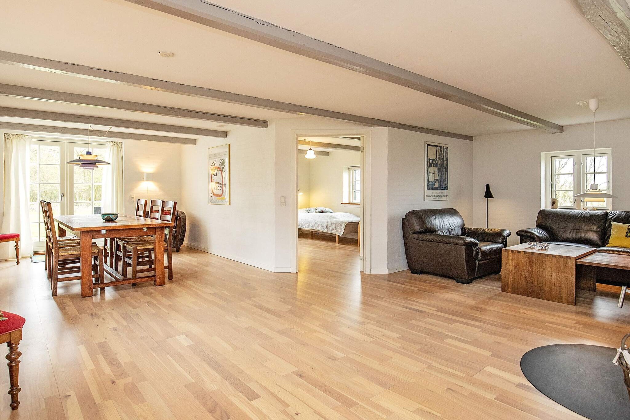 open kitchen(cooker(electric), hood, coffee machine, microwave, dishwasher, fridge(+ freezer)), Living/bed room(double folding bed, TV(danish TV channels (DR1 and TV2)), DVD player, radio, high chair), bedroom(double bed, children\'s bed), bedroom(double bed), bedroom(2x single bed), bathroom(floor heating)(bathtub or shower, washbasin, toilet, washing machine), terrace, BBQ