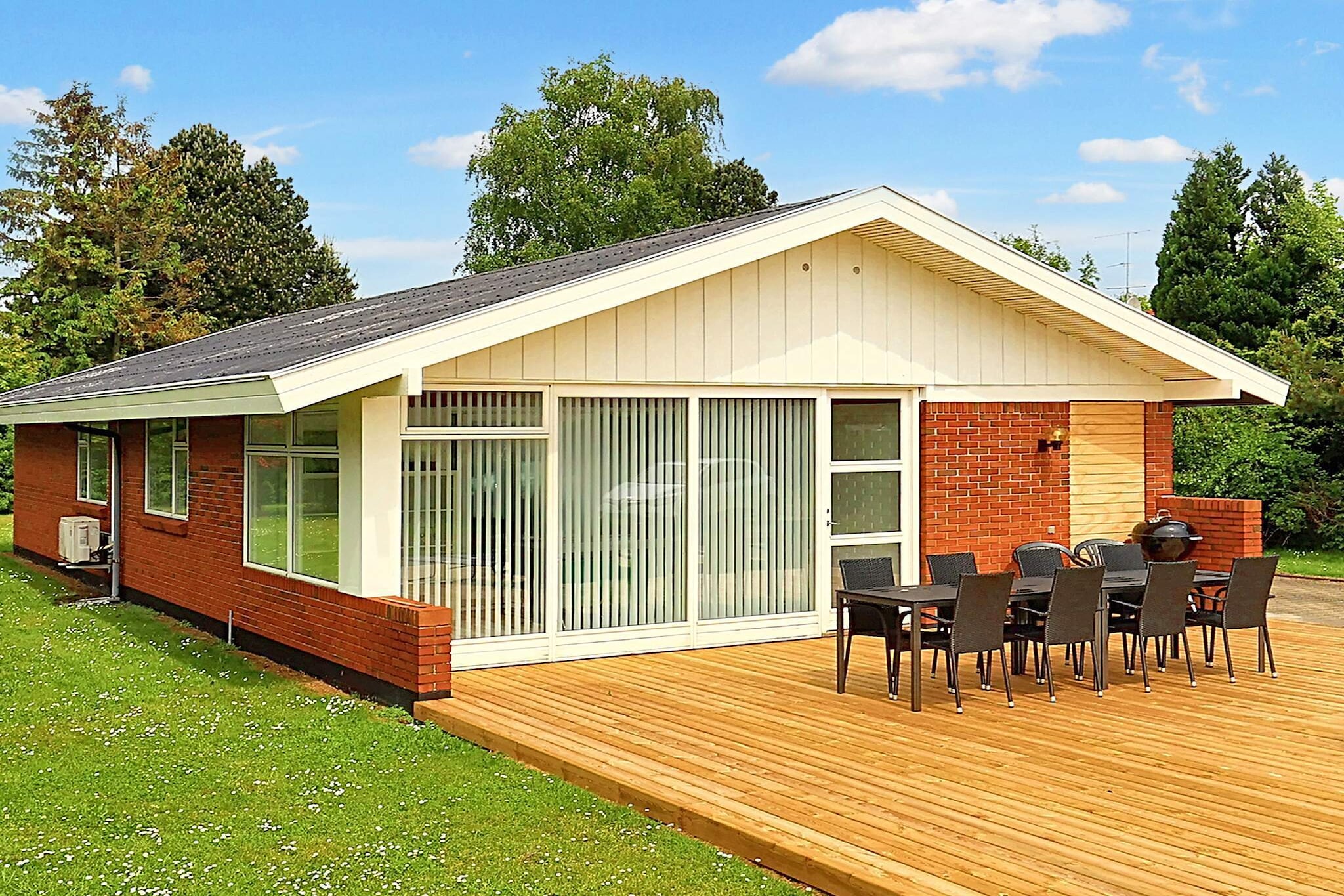 Annex: (2x single bed)\n\nInternet Access DSL, open kitchen(cooker(electric), hood, coffee machine, microwave, dishwasher, fridge-freezer), Living/bed room(TV(cable, german television channels, danish TV channels (DR1 and TV2)), DVD player, radio, CD player, stereo unit, high chair, chromecast), bedroom(double bed, cot), bedroom(double bed), bedroom(2x single bed), bathroom(tumble dryer, bathtub or shower, washbasin, toilet, washing machine), carport, game computer, heating(electric), terrace, BBQ, play equipment