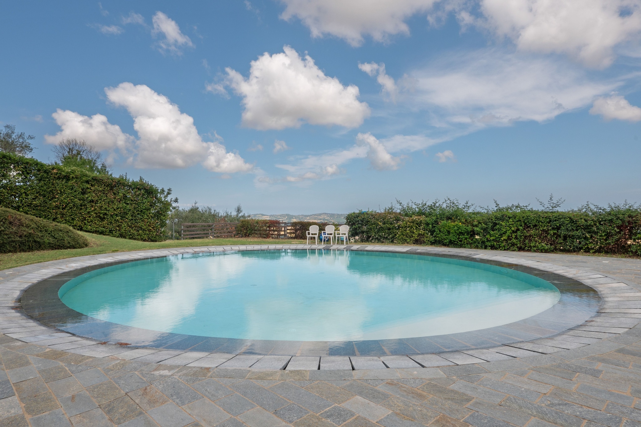 Enjoy refreshing dives in the swimming pool, shared with the owner and other guests, and beat the scorching summer heat. Unwind in the shared lawn with a good book and watch your kids play around you. There is private parking so your cars can stay safe and the modular kitchen is adequate for self-catering.

A bakery, restaurants and the city centre lie within a 500 m radius. Campo del Boriccio ecological park is close by, so does a museum and supermarkets. Day trips to Parco Naturale Monte San Bartolo and state park and Fiabilandia amusement park at 24 and 50 km away would be fun.

Notably, this is a first-floor apartment in a Big Noble Villa dated 1563, both of which are Italian Belle Arti Heritage. You have access to WiFi, cot and high chair for free. Air conditioning is provided and so is heating for a small fee.

Federico Fellini Int'l Airport is 48 km away.
Note- The swimming pool is opened from 15th May till 30th September every year.