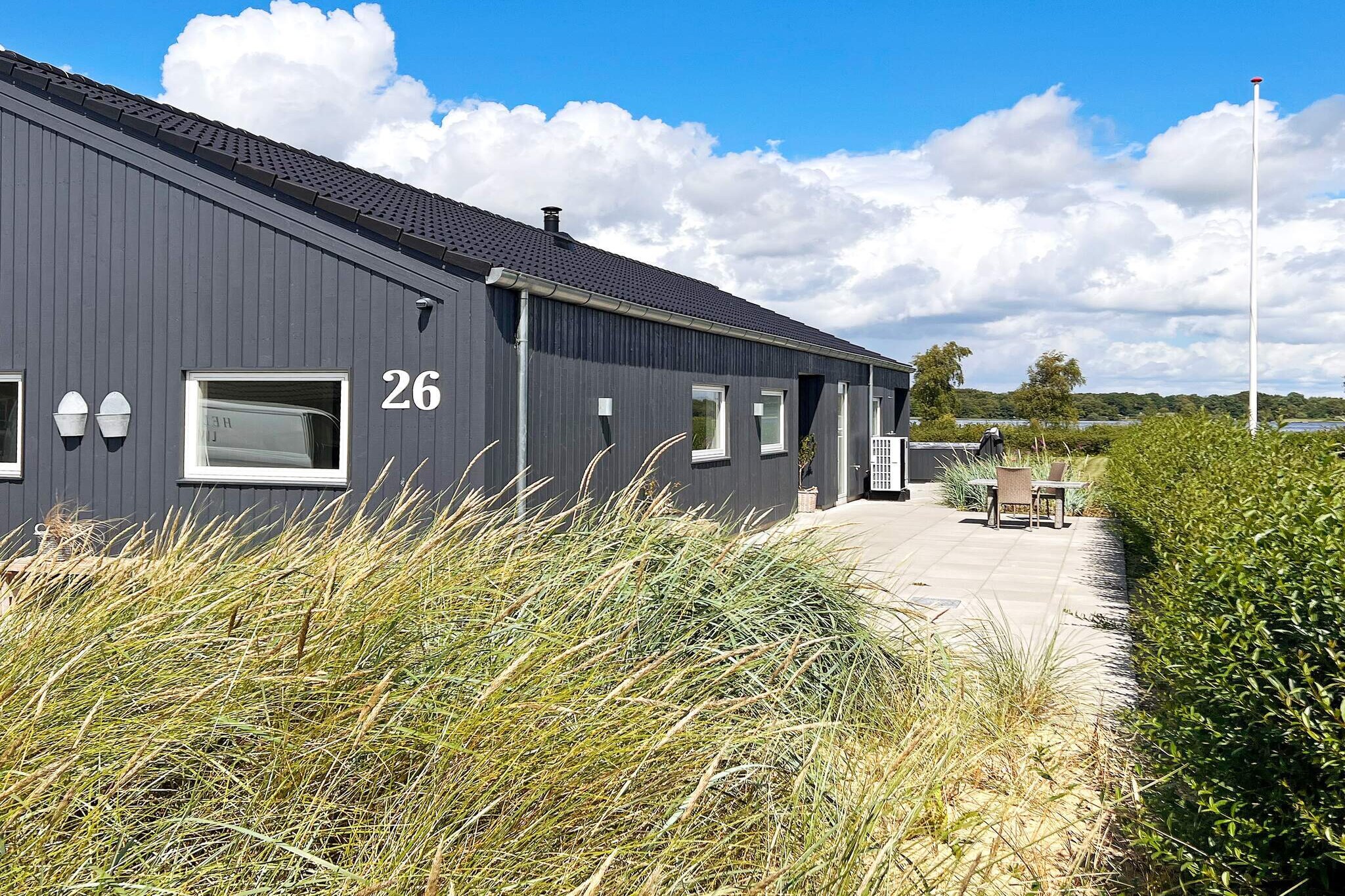 Internet Access DSL, open kitchen(cooker(electric), coffee machine, microwave, dishwasher, fridge-freezer), Living/bed room(TV(cable, german television channels, danish TV channels (DR1 and TV2)), radio), bedroom(double bed), bedroom(double bed), bedroom(double bed), bedroom(double bed), bathroom(floor heating)(tumble dryer, bathtub or shower, washbasin, toilet, washing machine), bathroom(floor heating)(bathtub or shower, washbasin, toilet), game computer, Bubble bath(outside, 4 persons), heating(electric), terrace, terrace(roofed), air to air heatpump