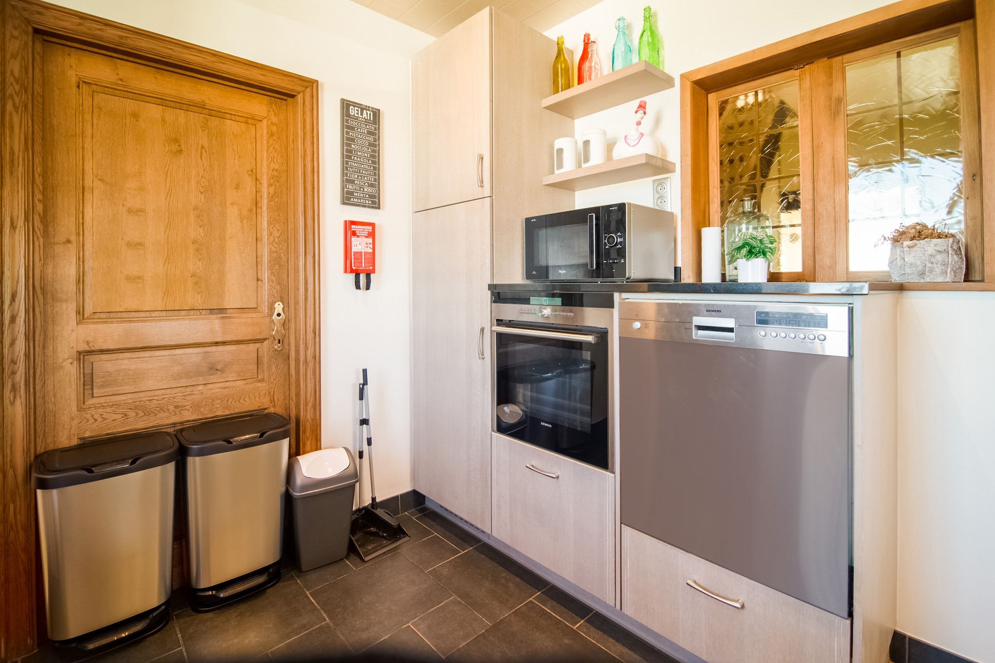 Ground floor: (Entrance(shared with the owner ), hallway, Sitting room(TV(flatscreen, digital), seating area(6 persons)), dining room(dining table(6 persons), high chair), Kitchen(electric kettle, toaster, cooker(4 ring stoves, ceramic), hood, coffee machine, oven(grill-oven), microwave, dishwasher, fridge), heating(central))\n\nOn the 1st floor: (bedroom(double bed(twin duvet, 160 x 200 cm), bunk bed(duvet, 90 x 200 cm), TV(flatscreen), cot), bedroom(double bed(twin duvet, 160 x 200 cm)), bathroom(bath tub, shower, 2x washbasin, toilet, hairdryer), Study, Landing, heating(central))\n\nBasement: (freezer, tumble dryer, washbasin, washing machine)\n\ngarage, carport, bathtub or shower, patio, courtyard, terrace, garden, bicycle storage, garden furniture, sun loungers, BBQ, parking, deckchairs, boules court, children\'s bed, solar energy, party games, Swing set, Charging post for electric cars