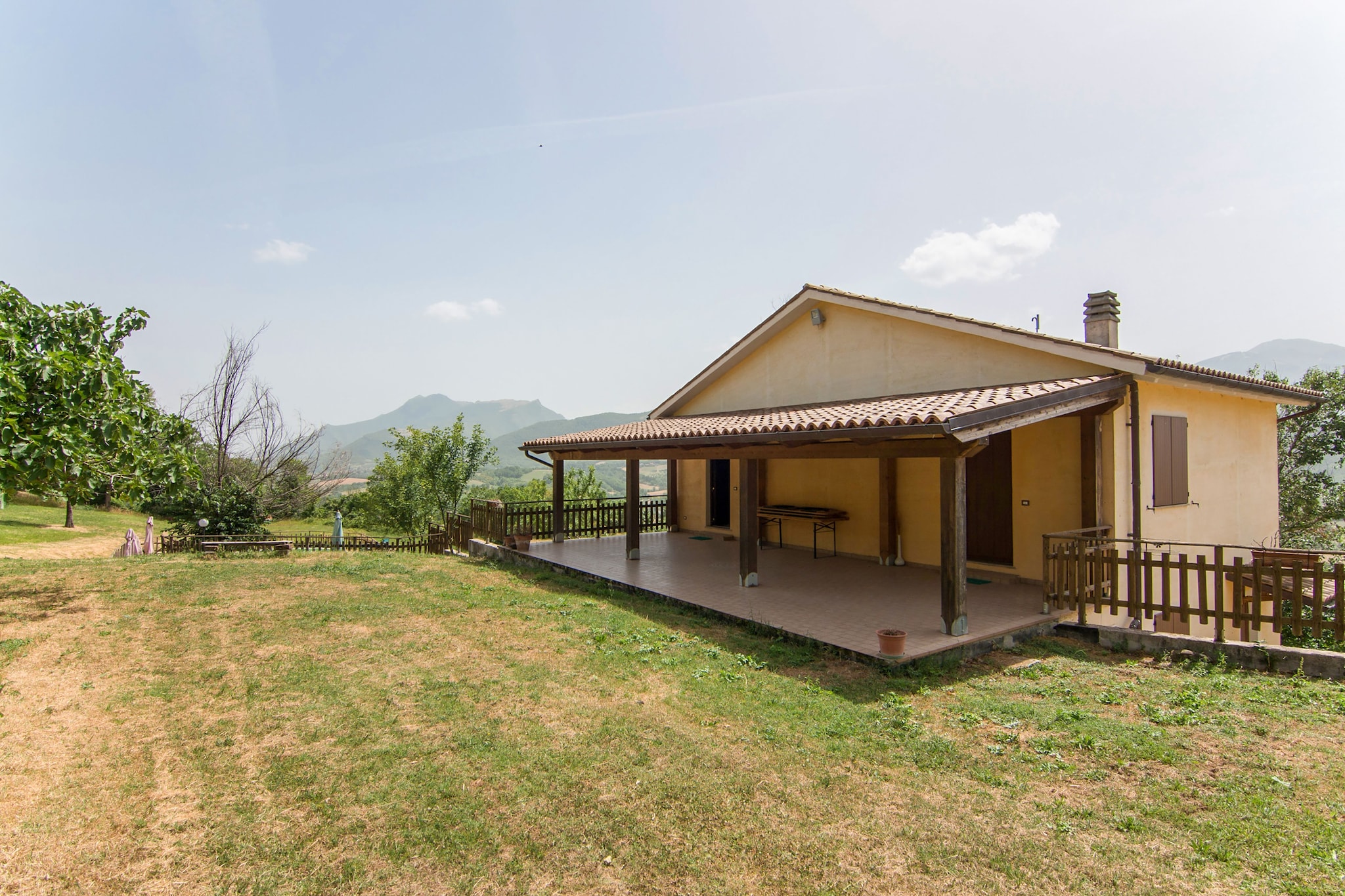 Located in Serra SantʼAbbondio surrounded by countryside and mountains, close to the ski slopes, this villa features 4 quadruple rooms with ensuite bathrooms. Free Wi-fi makes sure that you can work remotely or surf and stay connected to the world.

A large well-equipped kitchen ensures that you can whip up a meal or snack. An outdoor private pool, BBQ, garden, and terrace are some of the added delights. Parking books for a safe spot for your car. This beautiful country house is surrounded by 1 hectare of greenery and is suitable for families and groups.

Gubbio and Pesaro are 24 km and 45 km away respectively. Restaurant and Supermarket can be accessed within a mile. Fronton Castle and Sitria Abbey lie a short drive away to breathe in the culture and heritage of this area. 

Marche Airport is 100 km away.