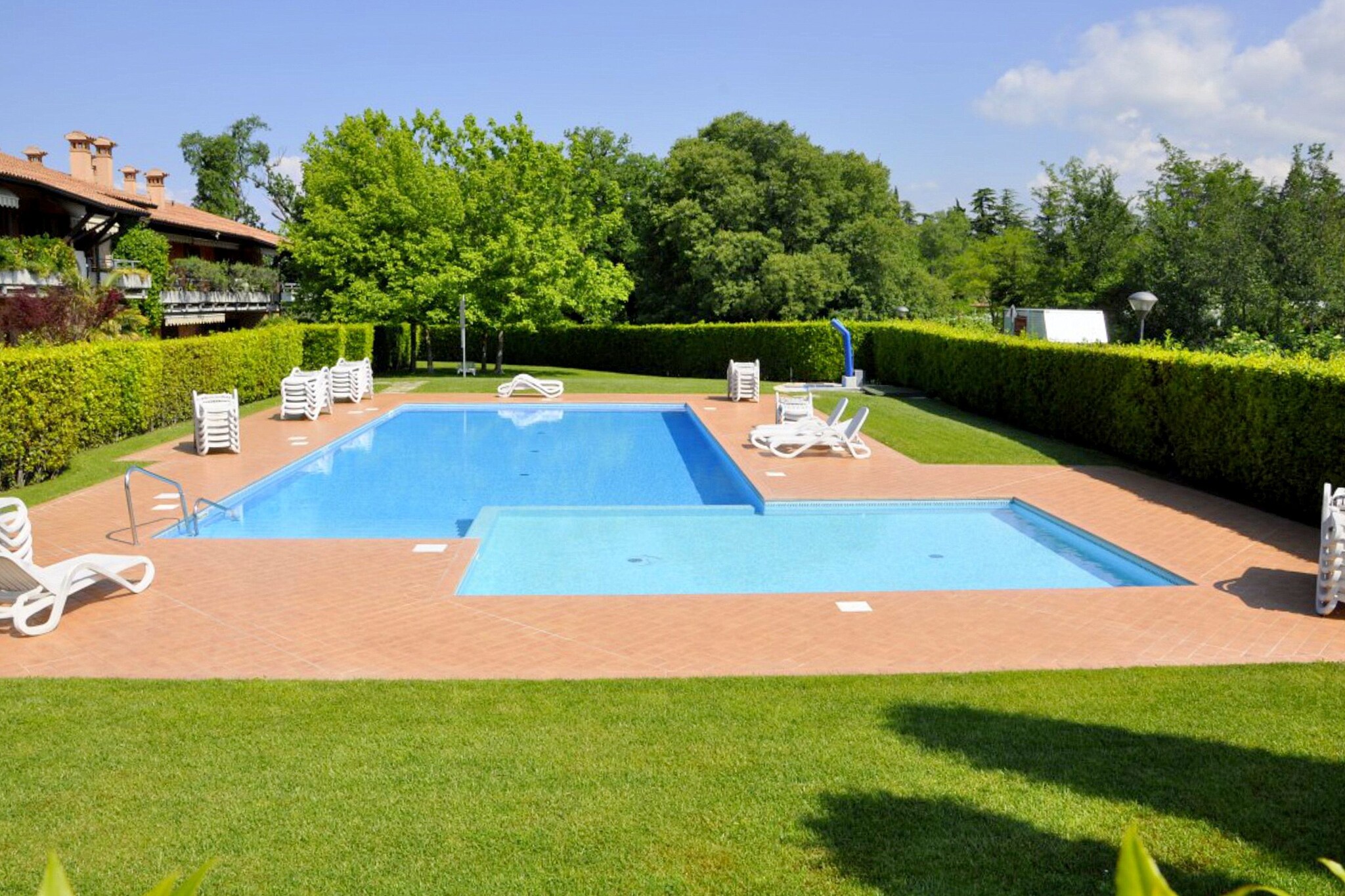 Perfect for a fun-loving family with children, this is a 1-bedroom holiday home in Lazise, close to Lake Garda. You have access to a shared swimming pool where you can take a refreshing dip on a hot summer day. The home can accommodate a total of 4 guests._x000D_
_x000D_
The holiday home enjoys a central position, at only 1 km from the lake and from the ancient town walls of Lazise. Restaurants to enjoy Italian delights and supermarkets to fetch groceries are within a walking distance, at 0.3 km and 0.4 km, respectively. Gardaland and Caneva Aquapark are great to enjoy a water-filled day with kids. The beautiful cities of Venice and Milan are nearby for day-trips._x000D_
_x000D_
The holiday home has central heating. On the sofa bed in the living room, you can comfortably watch TV or read a new book. The new recipes you try in the kitchen can be enjoyed together on the private terrace. After returning from walks and excursions, you can relax in the garden with garden furniture. A garage is available.