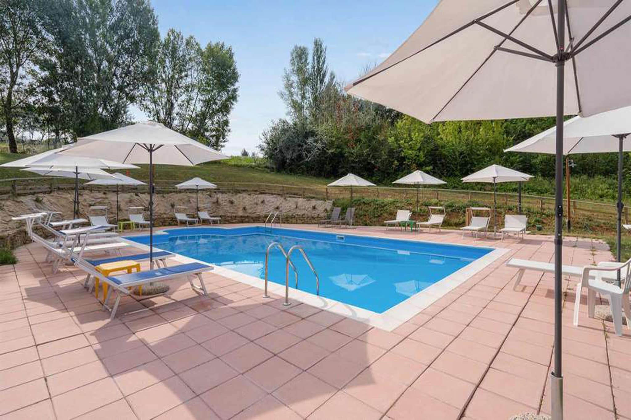 An apartment in Montone, Italy with a shared pool and fitness equipment to provide you with chances to chill and keep fit while being on a holiday. Free Wifi will keep you connected to the world.

The beautiful surroundings are ideal for cycling and hiking. A visit to nearby places such as Camporeggiano, Spedalicchio or Calzolaro is also possible. You have access to a fishing pond, a restaurant with breakfast options, a playground, a fitness trail, daily excursions, a bike path and trekking, a babysitting service, a picnic area, a possibility for horseback riding, yoga lessons, massages, cooking lessons and a laundry service while here.

Garden and Patio are some great spots to spend time amidst nature. BBQ will treat you to some scrumptious smoked meat and provide an authentic experience. Kitchen with cooker and coffee machine lets you cook and enjoy coffee here.