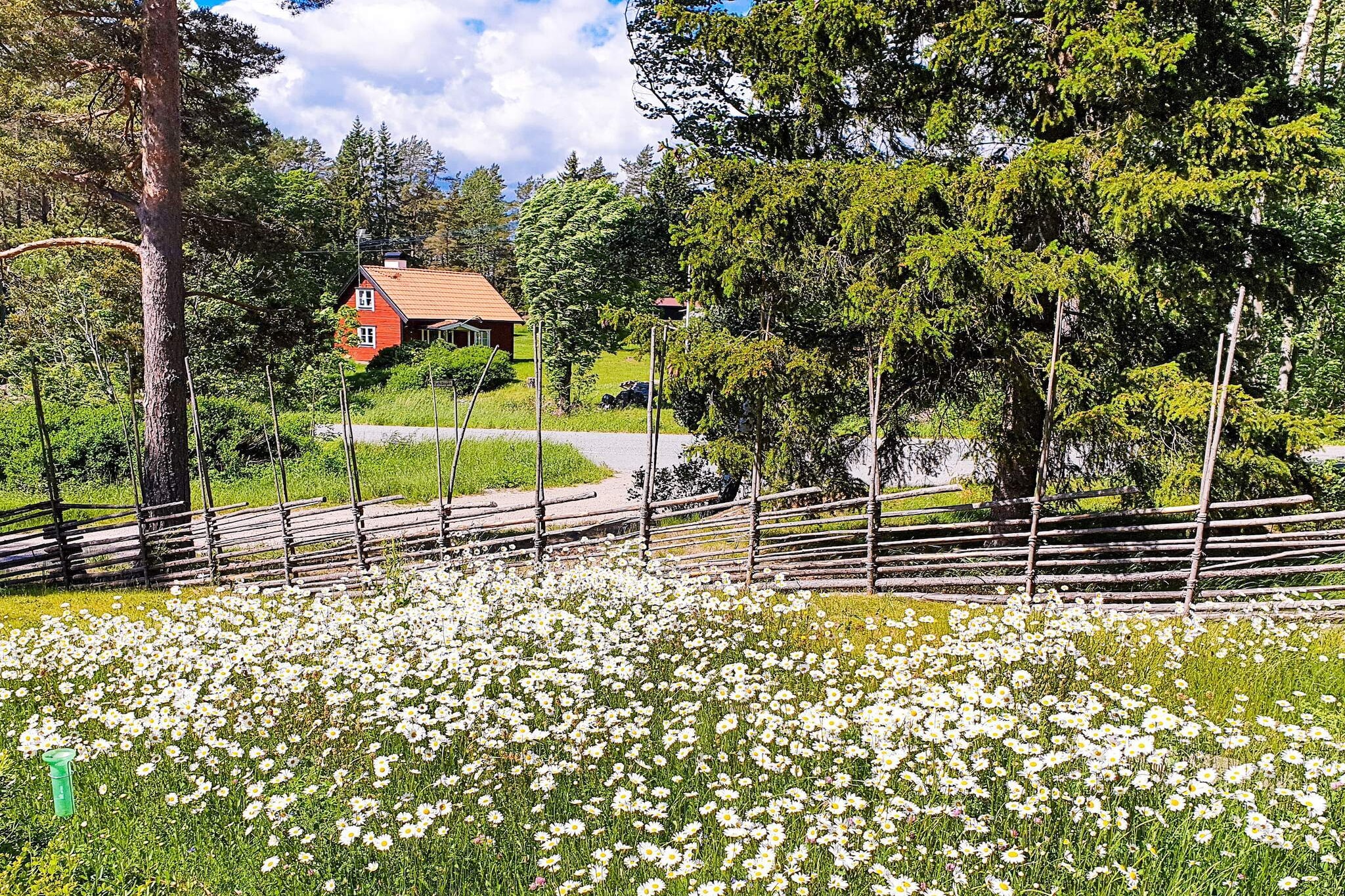 On beautiful island VÃ¤tÃ¶, just outside NorrtÃ¤lje, you will find this wonderful place, a large house with fantastic space and high ceilings, tastefully decorated and lovely plot with direct exit to the forest. Bathing areas are located everywhere on the island, including a lake with jetty. The living room and kitchen have an open floor plan with kitchen island, plenty of seating areas, cozy corner, dining area and sofa, a glazed patio with direct exit from the living room, here everyone can socialize and still have their own space if you want. Beautiful floors that come from an old church, cover the entire living room. There's a wood-burning stove for chilly evenings. The bedrooms are nicely decorated with comfortable double beds in two of the rooms and a bunk bed in the smaller. There are two bathing facilities, a bathroom with a bathtub and shower, a walk-in shower by the laundry room, and a guest toilet by one of the double rooms. A spacious laundry room with washing machine and dryer is also available. Please not that it's not permitted to charge your electric car on the plot. The plot is a little higher and has no direct neighbors, so it is free from transparency. A meadow is located in front of the house, where you can spot both moose and deer until the evening. Just a short walk to VÃ¤tÃ¶ sund there are swimming opportunities, perfect for a morning or evening swim. A few km from the house there is a center with shops for the essentials, but it is not far to NorrtÃ¤lje for larger shopping. The bus goes up on the main road, about 200m to go. In this house you get a lovely and comfortable holiday!
