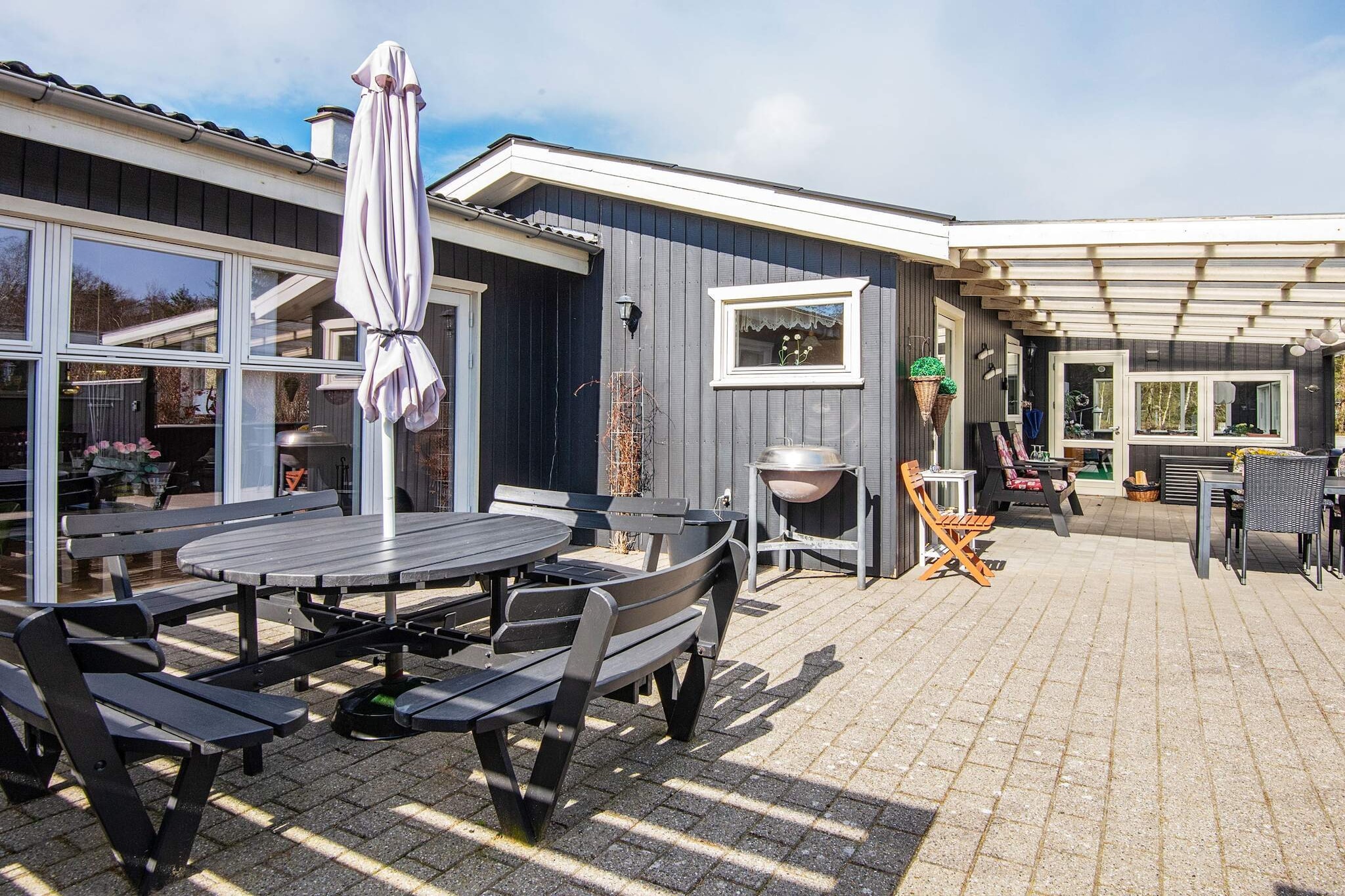 In Trend, you will find this renovated summer house, which is bright and cozy in just the right way. The house has an entrance hall, a well-equipped kitchen/family room with an open connection to the living room with high ceilings and a wood-burning stove, as well as three bedrooms. In addition, there is a large bathroom with a shower and washing machine. Spacious living room with wood-burning stove and internet. There are large, lovely terrace areas, both open and covered, designed so that you can enjoy the sun to the fullest and find both shelter and shade. A lovely garden room means that summer is especially long when you stay in this house. Large grounds designed for family vacations with time for togetherness, including a campfire area in one corner where both children and adults can enjoy some quality time. Youth groups are not permitted.A refundable deposit might be charged closer to your check-in date. TheÂ securityÂ depositÂ ensuresÂ aÂ smoothÂ stayÂ andÂ coversÂ any additionalÂ servicesÂ orÂ consumptionÂ charges.ThisÂ depositÂ coversÂ utilitiesÂ consumedÂ duringÂ yourÂ stay andÂ anyÂ additionalÂ servicesÂ thatÂ mayÂ beÂ taken.TheÂ finalÂ amountÂ willÂ beÂ adjustedÂ basedÂ onÂ actualÂ meter readings,Â actualÂ usageÂ ofÂ extraÂ services,Â andÂ anyÂ remaining balanceÂ willÂ beÂ refundedÂ withinÂ 21Â daysÂ afterÂ checkout.ThisÂ depositÂ simplyÂ actsÂ asÂ aÂ prepaymentÂ forÂ chargesÂ that Â youÂ wouldÂ anywaysÂ payÂ for,Â ensuringÂ aÂ seamlessÂ stayÂ and check-outÂ experience.