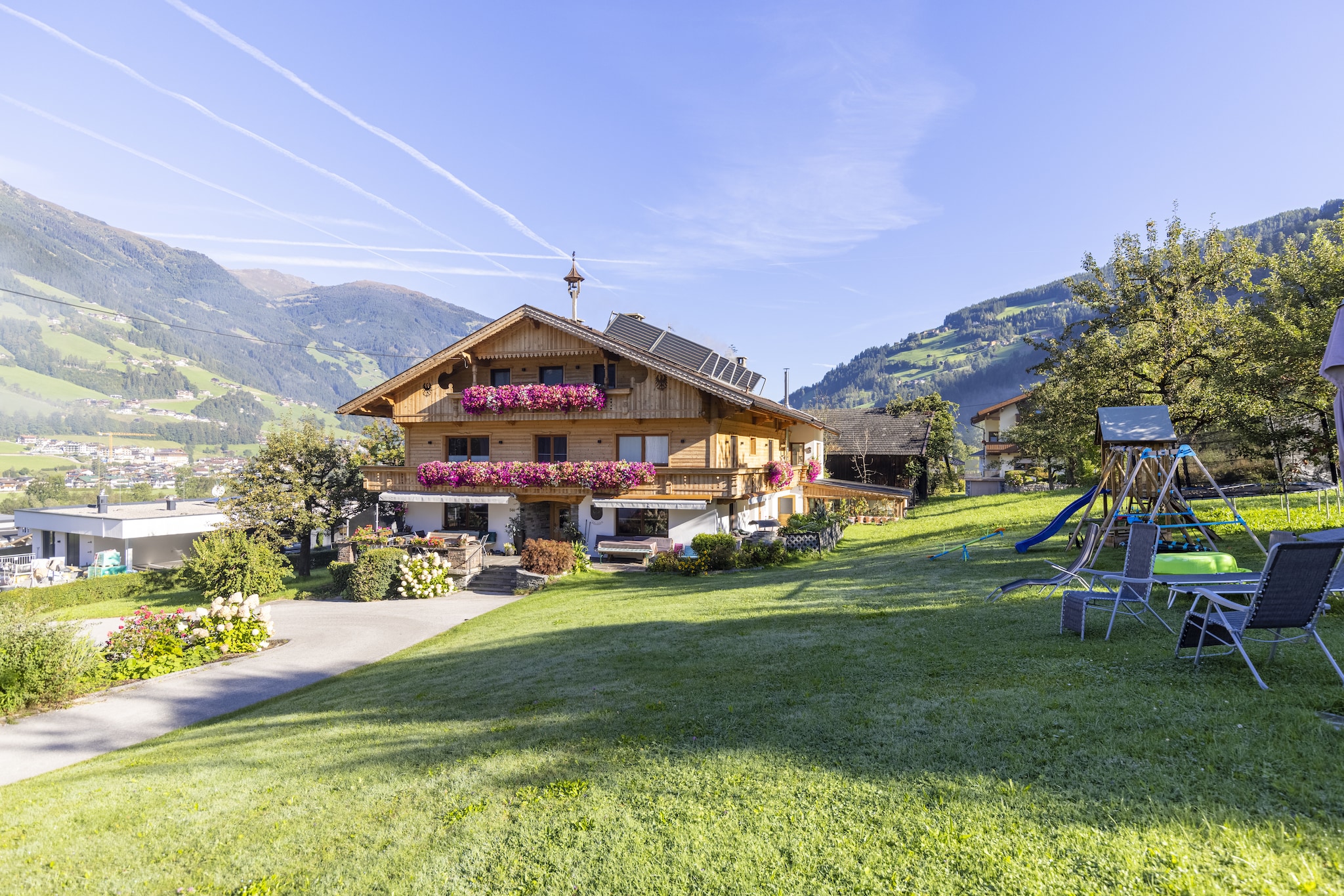 Holiday home for 18 people in Ramsau in the Zillertal
Winter: the bus stop is just 150 m away and provides a direct connection to Zillertalarena!

Holiday home MOIKLERHOF is located in a sunny location in Ramsau im Zillertal in the district of Bichl, 3.5 km from the centre of Mayrhofen and 1.5 km from the centre of Ramsau. There are restaurants and shops in the centre of Ramsau. The distances to all public amenities are 4.5 km to the Penken mountain railway, 1.5 km to the Horberg mountain railway and 1 km to the supermarket. Restaurants approx. 200 m. In summer, you get free admission to the outdoor swimming pools in Hippach and Mayrhofen.
5000 m² of land with garden furniture and children's play equipment are at your disposal. A large common room with a new modern kitchen as well as play area and a collection of games are also available. The house has 2 balconies. Parking on the property is free. The farm is operational (dairy farming/poultry) and is about 50 m from the holiday home. Products can be bought on the farm. The house was completely renovated in spring 2021. There are five rooms on the first floor and three rooms on the second floor, each with a shower and WC, satellite TV, free WiFi and a balcony.
There is also an infrared cabin for 2 people in the new wellness room.
The owner and his family live on the 1st floor of the house (same staircase) and the owner's parents live on the ground floor. 

Interior
9-room part of the house divided over 3 floors measuring approx. 350 m².
Ground floor: separate entrance in hall. Large lounge (approx. 90 m²) with dining area (corner benches, chairs), comfortable couch, satellite TV and children's play area, kitchen separated by a cooking island (4 ceramic hobs, 2 ovens, microwave, dishwasher, 2 fridge/freezer combinations, large filter coffee machine, kettle , toaster, slicer), with access to the pantry. 2x WC/sink.
1st floor: 2 double rooms, each with shower/WC. 2 bedrooms, each with a double bed, single bed and shower/WC. Single room with shower/WC.
2nd floor (slanted roof in some areas): 2 double rooms, each with shower/WC. Bedroom with double bed, single bed and shower/WC.
All rooms are equipped with satellite TV, free WiFi and hairdryer. Balcony access from all bedrooms. 
