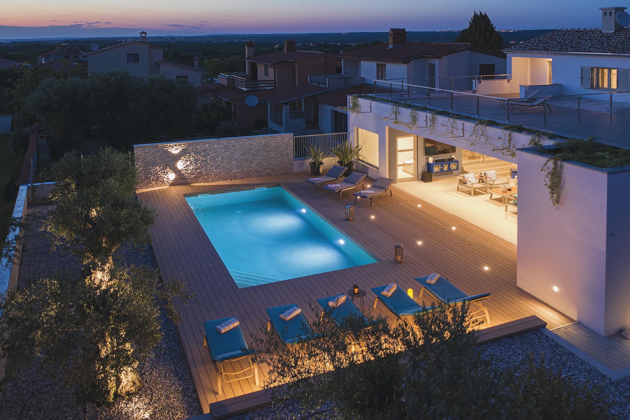 This modern and fully renovated Villa Balizerka is located in Stinjan in a prime location not far from Pula and Fazana, making it an ideal choice for your holiday. You can reach the beautiful beaches and clear sea in just a few minutes drive. The villa consists of 5 spacious fully equipped bedrooms and can accommodate up to 10 people. It extends over three floors, so on the ground floor awaits you the living room, dining area and kitchen, which are well connected to the outdoor kitchen and the covered terrace where the dining table is located, as well as the lounge area with comfortable seating and satellite TV. In addition, on the ground floor there is a detached apartment with one bedroom and a bathroom and an additional bathroom in the outdoor kitchen. Just below the first floor there is one bedroom and bathroom, while the first floor has three bedrooms. The interiors are decorated in Mediterranean style and yellow-blue shades which will create the ideal marine atmosphere for your dream vacation. Since you have indoor and outdoor kitchens at your disposal, it is up to you where to prepare delicious meals with your loved ones without having to worry about anything because you have absolutely everything at your disposal. If you wish to relax you can escape to the balcony and enjoy the sea view or simply lie down by the pool surrounded by Mediterranean plants and forget about all the problems. Villa Balizerka in Stinjan is definitely the best choice for your next destination!