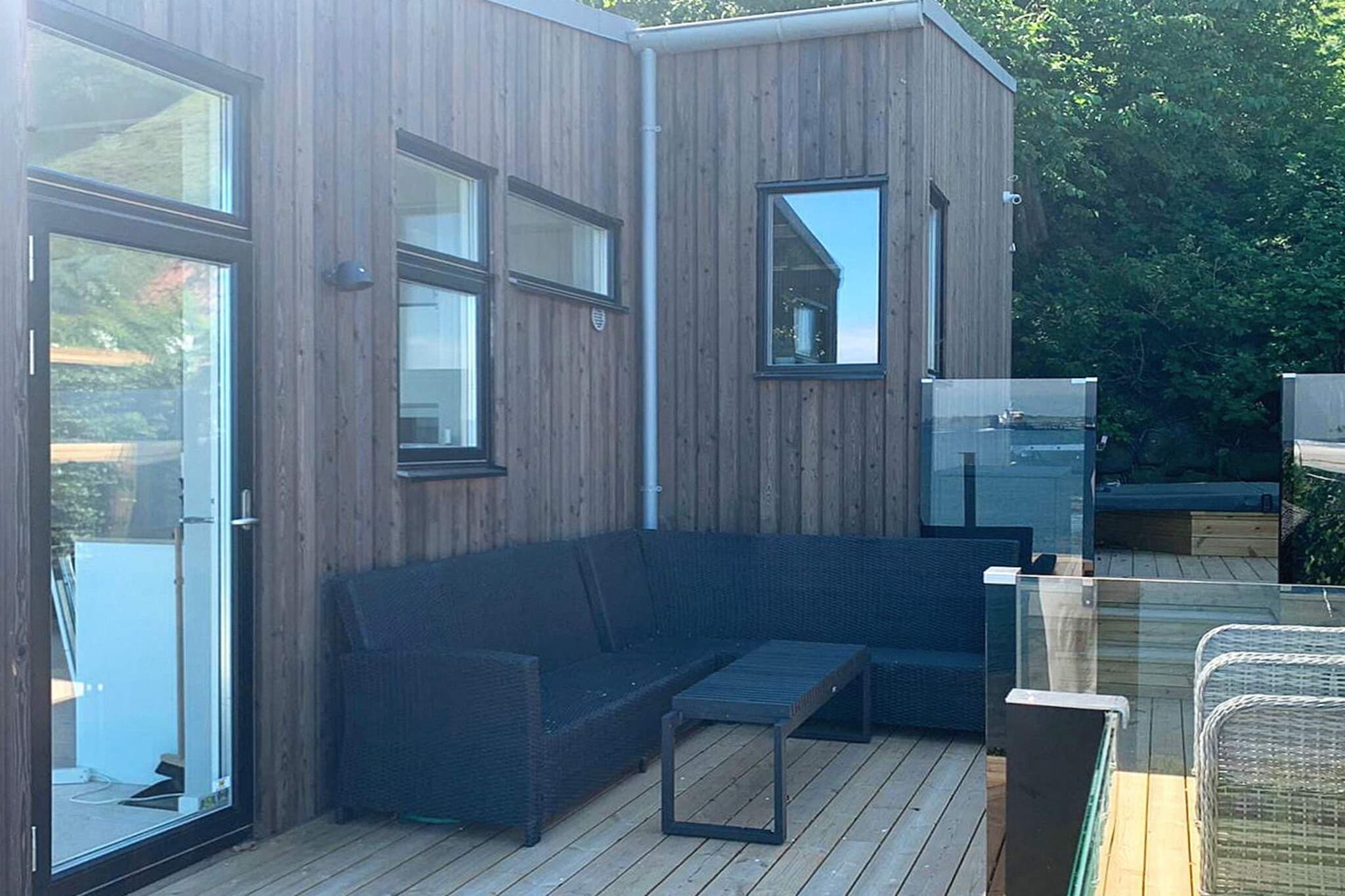 The house on Ven On a plot a stone's throw away from the beach is the newly built house "Venvillan", probably the island's most stylish and modern house. With its unique location, it offers both panoramic views of the sea and the Öresund coast and a scenic environment with sheep pastures around the knot. It is ideal for larger families or groups who want to enjoy the quiet idyllic environment, the proximity to the sea with a private jetty and relaxation in their own hot tub! Already in the hall, the house opens up with airy and light interiors where consistently stylish and modern material choices have been used. The core of the house is the spacious room where the kitchen, dining area and sofa groups coexist in the light that flows in through the panoramic glass wall. The fully equipped kitchen works great for cooking meals that can then be enjoyed indoors or out on the large terrace. The lounge area with comfortable sofas invites to relaxing moments with board games or in front of the SmartTV (Apple). The exclusive feeling continues with high-tech solutions throughout in terms of lighting, ventilation, alarms, camera surveillance and of course free wifi. Final cleaning is also included in the villa's rental price. There is a fresh bathroom with shower and washing machine, good storage space in cabinets and closets throughout the house. The beds are distributed in three function-smart bedrooms for up to 9-10 people, but you live most comfortably with a maximum of 8 people. One bedroom has 1 double bed, the other bedroom 1 double bed and 1 single bed in a sleeping loft. The third bedroom has 1 single bed, 1 wider single bed (120 cm), 1 pull-out single bed, and 2 beds in the sleeping loft that are suitable for children / adolescents. The house has underfloor heating and a cozy stove for cooler days and comfortable AC via the ventilation system when the sun is on. On the spacious terrace you can enjoy the beautiful view or the sunset over Öresund, perhaps after a good barbecue meal. Or why not relax in the stainless steel hot tub, where you can sit under starry skies and just enjoy the holiday! in the hot tub there is room for 4 people. The detached garden also has beautiful views from all furnished patios, lawn and barbecue area. Only about twenty meters down to the shore, you have your own bathing jetty with a bathing ladder that invites to many dives. You can also walk or cycle (2 km) to Norreborgs bathing area. With its unique location by the shore, you can only reach Venvillan via the walking and cycling path that surrounds the island, about 10 minutes from the ferry terminal. The island is perfect for exploring by bike or on foot. Therefore, we recommend parking the car at one of the free car parks available at Vens Cykeluthyrning or Alpacaboden to then rent or bring your own bikes to the island. Take the opportunity to discover all of Ven's strawberry places and a wide range of activities! Walk along the hiking trails that surround the island, eat fresh fish in Kyrkviken harbor, explore all the arts and crafts shops or enjoy good culinary adventures at local restaurants. Take a round of golf at the nearby St. Ibbs Golf Course (9-hole), try the locally produced whiskey at Spirits of Hven in Backafallsbyn or visit the museum about the scientist Tycho Brahe who had his observatory on the island. The island offers something for all ages and areas of interest. If you wish to rent this house on other dates than what you find available, contact Stugsommar/DanCenter's office with your request, it is possible to rent the house also for a long weekend on request It is not possible for youth groups to rent the cottage. Welcome to this stylish house with a wonderful location on the beautiful island Ven where you are guaranteed to enjoy your holiday! Other: If you are interested in booking a shorter period than one week. Call the service office at: +46(0)31-155200, and maybe we can arrange it for you.