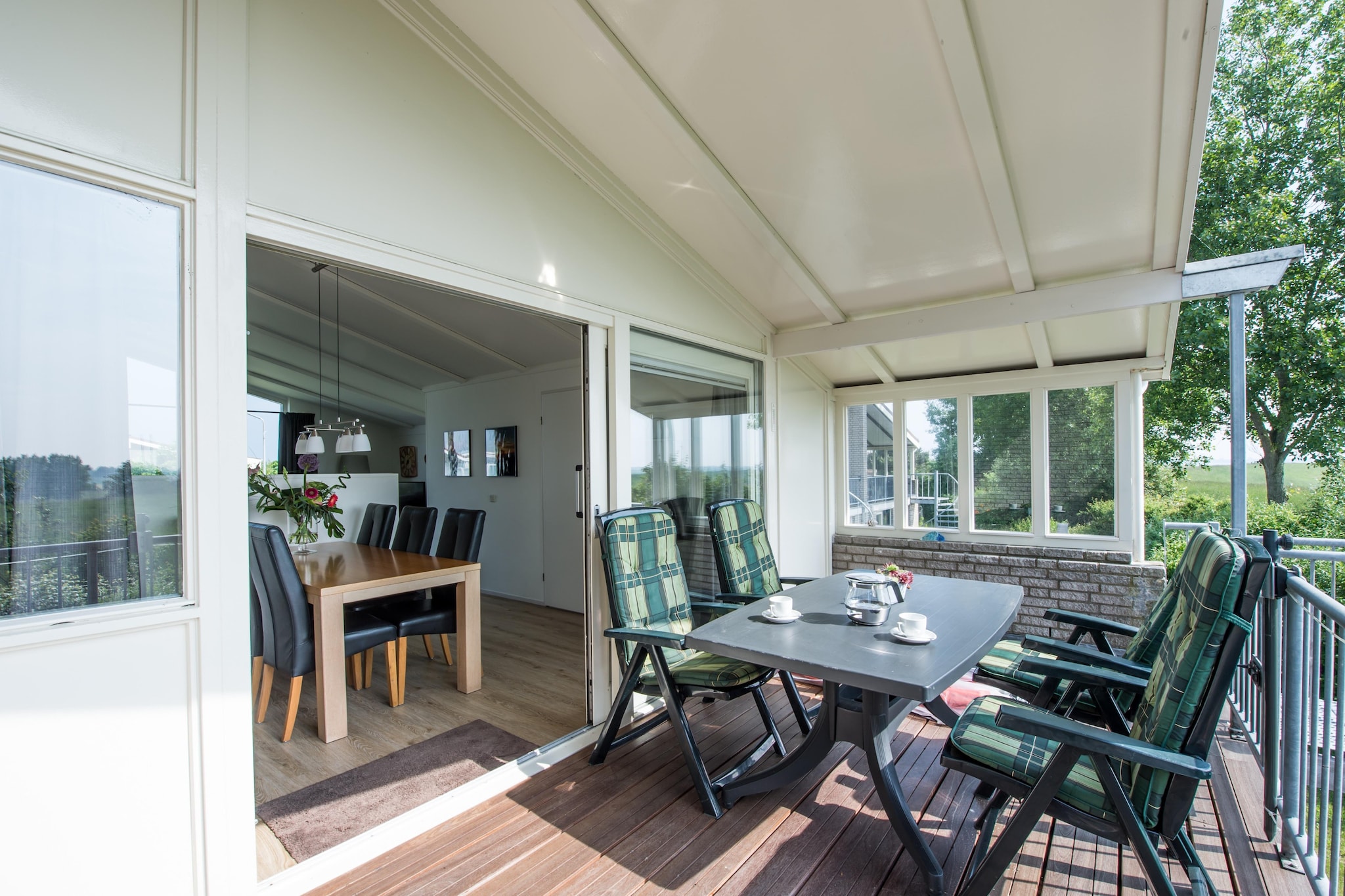 Ground floor: (bedroom(double bed(boxspring)), bedroom(double bed(boxspring)), bedroom(2x single bed(boxspring)), bathroom(shower, toilet), bathroom(shower, washbasin), toilet)\n\nOn the 1st floor: (Living room(TV(flatscreen, international television channels), seating area), Kitchen(dining table, coffee machine(pads), combination microwave, dishwasher, fridge-freezer), washing machine, balcony, terrace)