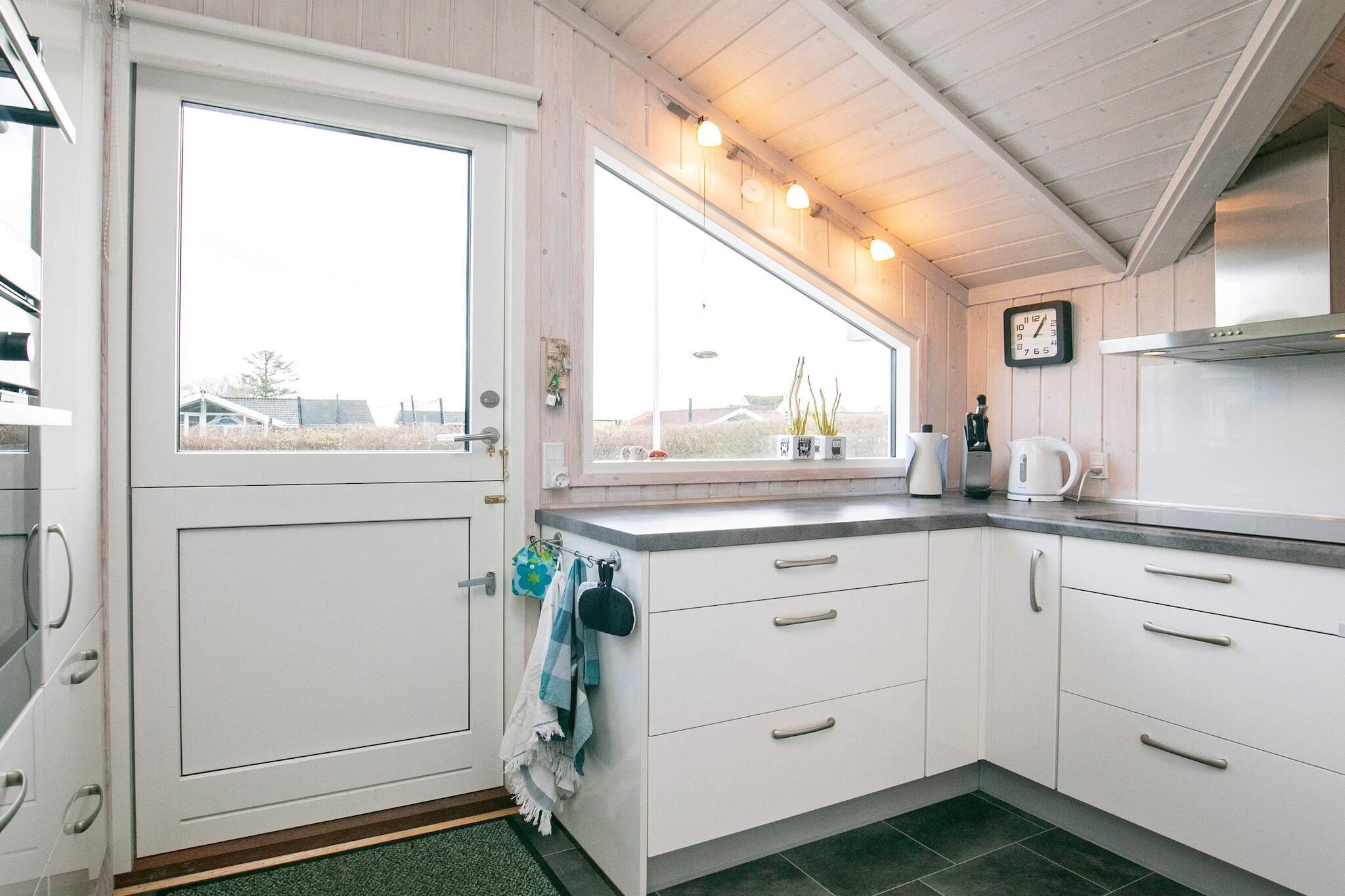 Annex: (tumble dryer, bathtub or shower, washbasin, toilet, washing machine)\n\nopen kitchen(cooker(electric), hood, coffee machine, microwave, dishwasher, fridge, freezer(60-99L)), Living/bed room(TV, radio, chromecast), bedroom(double bed, children\'s bed, children\'s bed), bedroom(double bed), bedroom(double bed), bedroom(2x bunk bed), bathroom(floor heating)(bathtub or shower, washbasin, hip bath, toilet), bathroom(washbasin, shower, toilet), carport, sauna(indoor, heated, 3 persons), heating(electric), terrace(roofed), garden, BBQ, play equipment, fish cleaning table, air to air heatpump