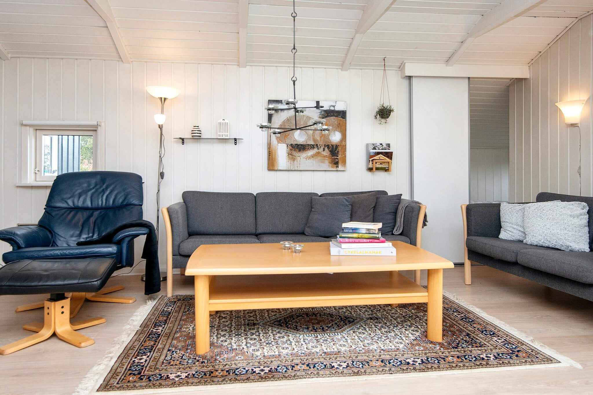 Internet Access DSL, Sitting room(single bed), open kitchen(cooker(electric), hood, coffee machine, microwave, dishwasher, fridge(+ freezer)), Living/bed room(TV(cable, german television channels, danish TV channels (DR1 and TV2)), DVD player, CD player, stereo unit, high chair), bedroom(double bed, cot), bedroom(double bed), bedroom(double bed), bathroom(floor heating)(tumble dryer, bathtub or shower, washbasin, toilet, washing machine), bathroom(floor heating)(washbasin, toilet), carport, game computer, Bubble bath(indoor, heated, 2 persons), sauna(indoor, heated, 6 persons), heating(electric), terrace, terrace(roofed), garden, BBQ, play equipment, darts, football goal, air to air heatpump