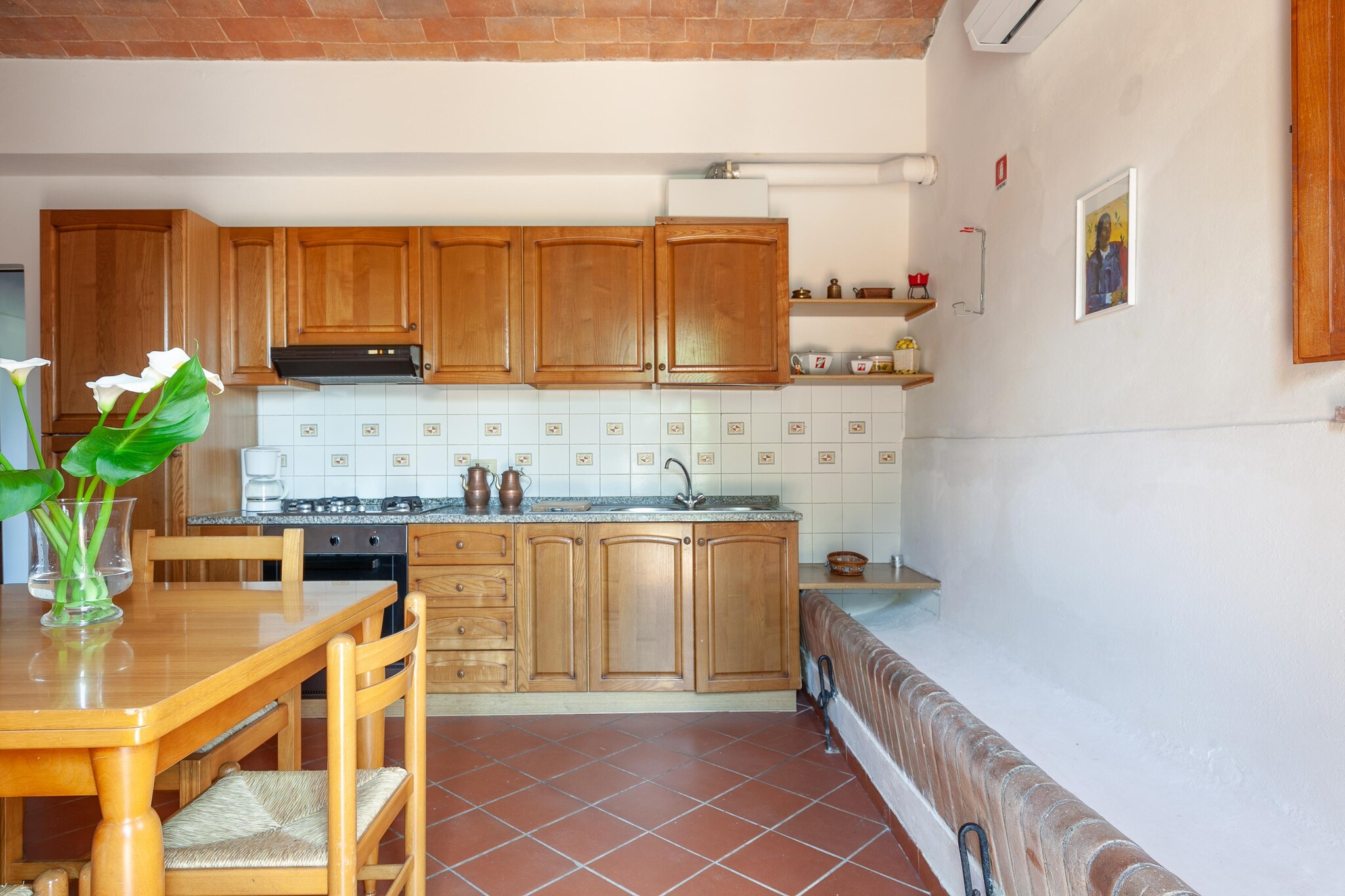 Ground floor: (Living room(double sofa bed, TV, dining table, seating area), open kitchen(hob, hood, coffee machine, oven, fridge-freezer, washbasin), bedroom(double bed, children\'s bed), bathroom(shower, washbasin, toilet, bidet), air conditioning)\n\nwashing room(washbasin, washing machine, ironing board, iron), patio, heating(central), garden, garden furniture, sun loungers, BBQ, parasol, swimming pool(shared with other guests, 12 x  6 m., opened from 1/2 May upto and including Sep), boules court, play equipment, table tennis table, football goal, bicycles available, children\'s bed(on request), Swing set