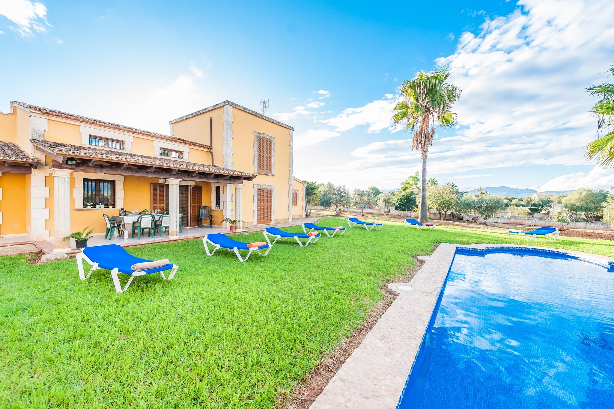 This is a 2-storey house with 4 bedrooms (one on the first floor and three on the ground floor). There are three bedrooms with double beds and one with 2 single beds.
Every room and detail is perfectly integrated in the house. Sit down and relax on the sofa in the living room where you will be able to read a good book, watch satellite TV and have a little nap. The kitchen is equipped with everything you might need during your holiday: toaster, blender, dishwasher, coffee machine, electric oven, gas stove, fridge, cutlery and a lot more. There is space to park your car at the patio. Furthermore, there is another kitchen with gas hob, situated in a separate building with BBQ by the pool.
At the terrace, there is a big table with 8 chairs where you can organize summer dinners. Outside, you can swim in the 10 x 5 metre pool, sunbathe in one of the 8 lounges or enjoy a cocktail at sunset.
Can Picafort and Capellans Beach is just a 5 minutes' drive. The fine grained beach is perfect for families or a long, romantic stroll. Lots of bars and restaurants offer Mediterranean cuisine and cocktails. Maybe you'd like to try a tasty Paella with sea views. Towards Alcúdia, you'll find Playa de Muro, a quiet and natural area with a white sand beach and cyrstalline waters. In Alcúdia old town or Pollença, visit the weekly market or walk around the cobbled streets. Consult the advertiser for possible charges. Pets are not allowed. The holding of events is forbidden. There is exterior parking for 8 cars.
Distances
Beach: 4.7 km - Capellans, Can Picafort
Airport: 61.1 km - Son Sant Joan
Golf course: 18 km - Alcanada
Town: 5 km - Can Picafort
Train station: 11.5 km - Sa Pobla
Bus stop: 6.1 km - Paseo Colon, Can Picafort
Ferry: 16 km - Puerto de Alcúdia
Hospital: 21.4 km - Inca
Tourist license: ETV/2639Single Rental Registry: ESFCTU0000070110001439420000000000000000000000ET26397The Ecotasa (tourist tax) must be paid cash on site when checking in. The amount varies between 0.55€/night and guest during the low season and 2.2€/night and guest during the high season. The tax is reduced by half from the 9th day of your stay. All guests have to pay the Ecotasa, except people under 16 years. Homerti - Central de Reservas CR/33