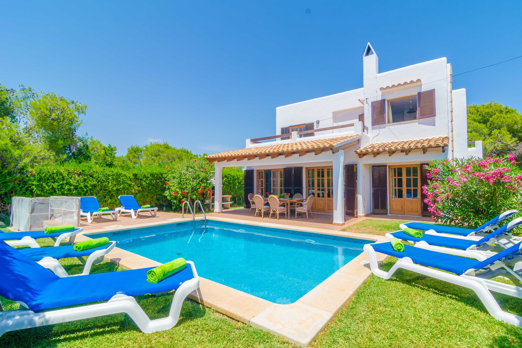 You won’t want to be in another place but the beautiful exterior area of this house. Of course, the central element is the chlorine pool sizing 7 x 4 metres and with a depth between 0.8 and 1.9 metres, around which you will enjoy the sun and weather the wonderful gardened area full of sunbeds. By the house, you will find the porch, ideal to have lunch or dinner outside while the little ones take a dip or play. You can also prepare delicious barbecues. . There is another terrace on the first floor, a little corner to relax at night and watch the starry sky. The property is fenced and there are attached neighbours.
The 250m2 house has two floors. On the ground floor you can rest in the living -dining room and watch the satellite television. It shares room with the dining area which can easily accommodate up to 8 people. The kitchen is independent and fully equipped, including a ceramic hob. There are 4 bedrooms to rest in the house. There are two of them on the ground floor and both feature twin beds, a wardrobe and a fan. A shower bathroom completes this storey. On the first floor you will find the other two bedrooms. One has a double bed, fan, wardrobe and an en-suite shower bathroom. The last one counts with twin beds, fan, wardrobe and exit to the terrace. There is also a bathroom with a shower for this floor. In addition, in the house you will find a washing machine, an iron and an ironing board, and the living room and bedrooms are air-conditioned.
This chalet is located in a quiet urbanization of Cala Egos in Cala d’Or. The nearest beach is that of Caló des Pou. It is a white sandy beach and it counts with date palms and trees to stay away from the sun. It is an environment characterised by a great natural beauty. Only 0.1 maritime mile away you will find the Cala d’Or marina. You can visit the “Fortí”, a military fortification from 1730 which is now a museum. The town of Cala d’Or is quite near and there you will find the basic services for your stay. You can also visit Santanyí and the Mondragó Natural Park.
AC is available from 14:00h till 16:00h and from 20:00h till 08:00h Consult the advertiser for possible charges. Pets up to 2.00 kg are welcome. The holding of events is forbidden.
Distances
Beach: 0.450 km - Caló des Pou, Cala d'Or
Airport: 55.7 km - Son Sant Joan
Golf course: 10.9 km - Vall d'Or Golsf, S'Horta
Town: 0.001 km - Cala d'Or
Train station: 29.9 km - Plaça de l'Estació, Manacor
Bus stop: 0.550 km - c/ de Sa Marina, Cala d'Or
Ferry: 63.6 km - Port de Palma
Hospital: 34 km - Hospital de Manacor
Tourist license: VT/1159Single Rental Registry: ESFCTU000007008000339666000000000000000000000VT/11595There's a mandatory tourist tax in Balearic Islands, called Ecotasa. All guests, except people under 16 years, have to pay this tax. The amount varies between 0.55€/night and guest during the low season and 2.2€/night and guest during the high season .The tax is reduced by half from the 9th day for your stay. Homerti - Central de Reservas CR/33