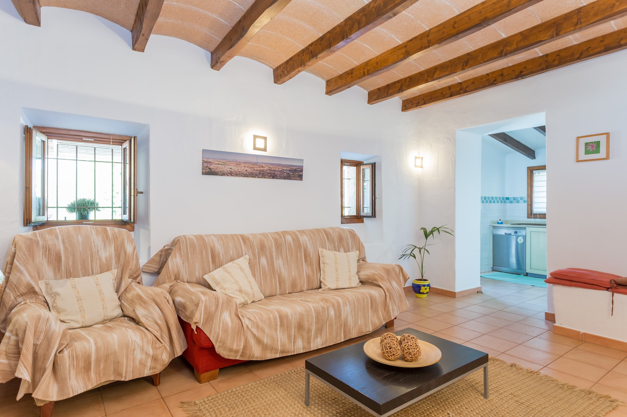 Welcome to Pou Vell! This cozy and rustic villa lies at a wonderful place in the north of the island and offers you the comfort of a home that will make your holidays an unforgettable experience.
The two-storey villa with a size of 142 m2 counts with 3 bedrooms and is ideal families or groups of friends. In the 1st floor you will find two bedrooms. The first one has two single beds, and the other one is fitted with a double bed, which also has an en suite bathroom. The bedroom located in the ground floor counts with two single beds. There are three bathrooms. Two upstairs, one with shower cabin and the other one with bath tub. And one is downstairs, which only has WC. The whole accommodation is equipped with air conditioning.
The whole villa emits a warm and peaceful atmosphere and is an excellent choice for those seeking relaxation. Sit down in the spacious living area and spend your time reading a good book, watching television (Satellite) or a film (DVD player) or just take a nap. The adjoining dining area is fitted with a nice table and seats for 6 people. In the independent kitchen you get everything you may need for preparing your meals: a toaster, coffee machine, microwave, , vitro ceramic hob, dishwasher, electric oven, cutlery, kitchen appliances and a refrigerator-freezer. Of course there is also a washing machine, an iron and ironing board.
The exteriors are beautiful: step outside and have a barbecue, swim in the pool or just relax in the terrace. The porch is furnished with a table and seats for 6 people. Next to the private pool, 8 x 4 meters, there is an area with sun loungers for you to get tanned. There are 5.500 m2 of land with lots of almond trees, orange trees, etc.
There are no direct neighbors and the house and its installations are completely private. Pets are welcome upon request – please ask before. You will be able to park up to 3 cars outside the house in an uncovered space.
The house is only 0.6 km from the closest village, Búger, and 4.5 km far from Sa Pobla, where you will find most of the things you will need during your stay: supermarket, medical center, pharmacy, bars, restaurants, etc. The beautiful village Pollença is also quite close. This place is worth a visit, you will enjoy its tiny cobbled streets with lots of shops, you will be able to go up to Calvari, a tiny church on the top of the village, where you will enjoy the astonishing views of the surroundings.
In only 20 minutes driving by car you will reach the beach of Capellans / Can Picafort. Pass a pleasant day on the fine grained sand beach or enjoy a cocktail while watching the sun goes down. You will find a good Paella restaurant there, a typical Spanish rice dish with meat, vegetables and seafood. Very tasty and spectacular views included! Apart of this beach area discover the main beach of Can Picafort with its animated sea promenade, the quiet zone of Playa de Muro and the crystal clear waters of the beaches of the municipality of Alcúdia.
The air conditioning is only available from: 06-11h, 13-17h and 20-02h Consult the advertiser for possible charges. Pets are not allowed. The holding of events is forbidden. There is exterior parking for 3 cars.
Distances
Beach: 20 km - can picafort
Airport: 46 km - palma
Golf course: 15 km - alcanada
Town: 1 km - buger
Train station: 4 km - sa pobla
Bus stop: 4 km - sa pobla
Ferry: 14 km - alcúdia
Hospital: 10.2 km - Hospital Comarcal de Inca
Tourist license: ETV/1488Single Rental Registry: ESFCTU00000702200016307600000000000000000000ETV/14881There's a mandatory tourist tax in Balearic Islands, called Ecotasa. All guests, except people under 16 years, have to pay this tax. The amount varies between 0.55€/night and guest during the low season and 2.2€/night and guest during the high season .The tax is reduced by half from the 9th day for your stay. Homerti - Central de Reservas CR/33 Electricity (January - December): 0.30 EUR/KW (mandatory) <br> <br />