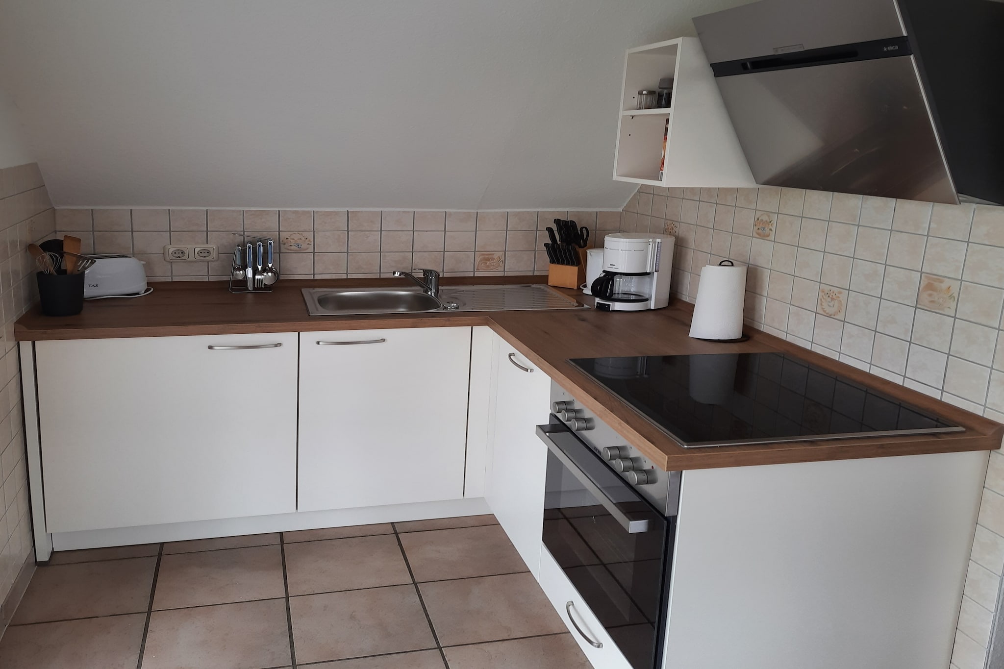 open kitchen(hob(4 ring stoves, ceramic), electric kettle, toaster, coffee machine, oven, dishwasher, fridge-freezer), Living/diningroom(TV, dining table, radio, CD player), bedroom(double bed), bedroom(2x single bed), bathroom(shower, toilet), heating(gas), parking, Towels/Sheets (extra fee)